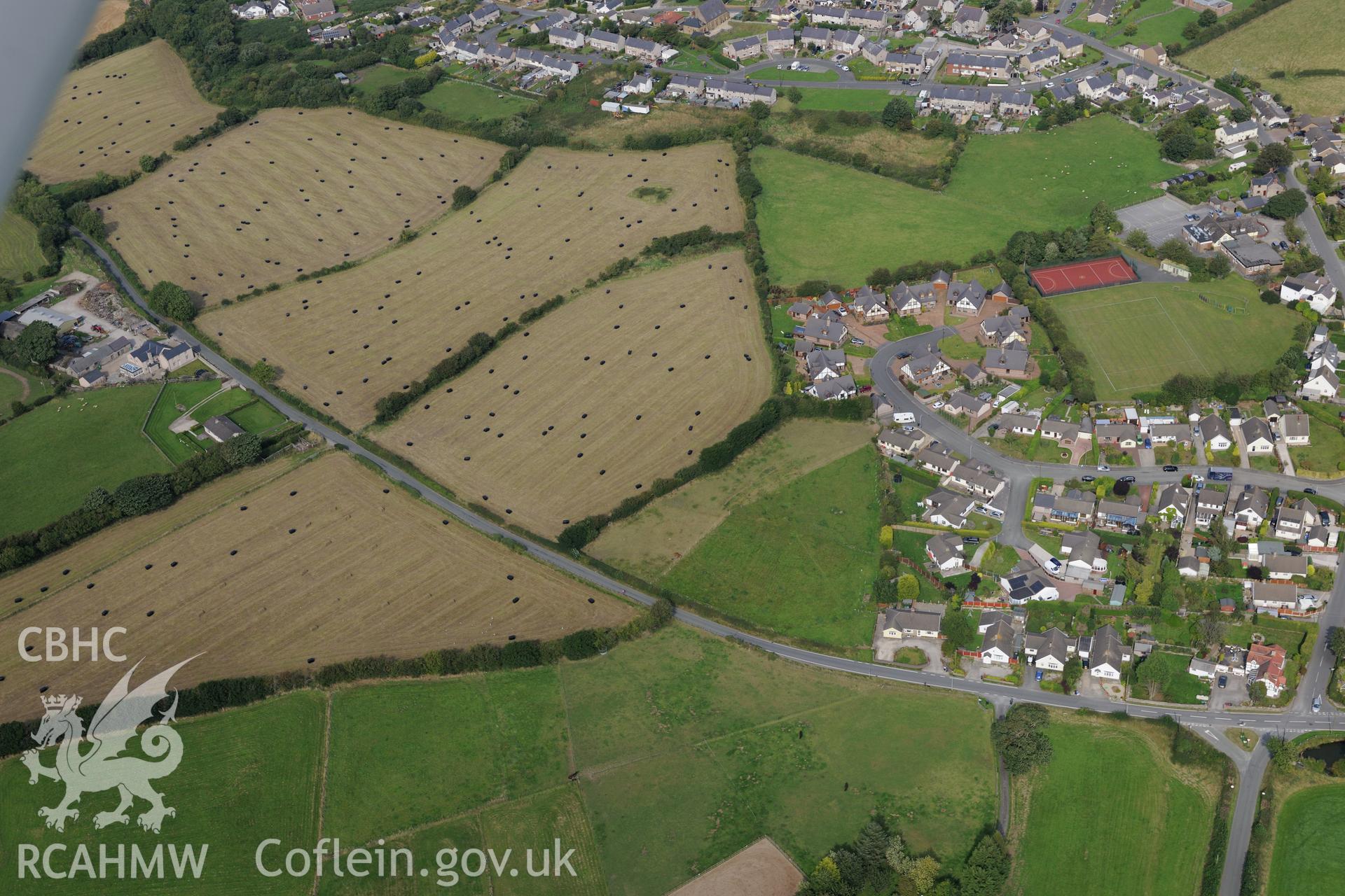 Berthengam, and a barrow to the west. Oblique aerial photograph taken during the Royal Commission's programme of archaeological aerial reconnaissance by Toby Driver on 11th September 2015.