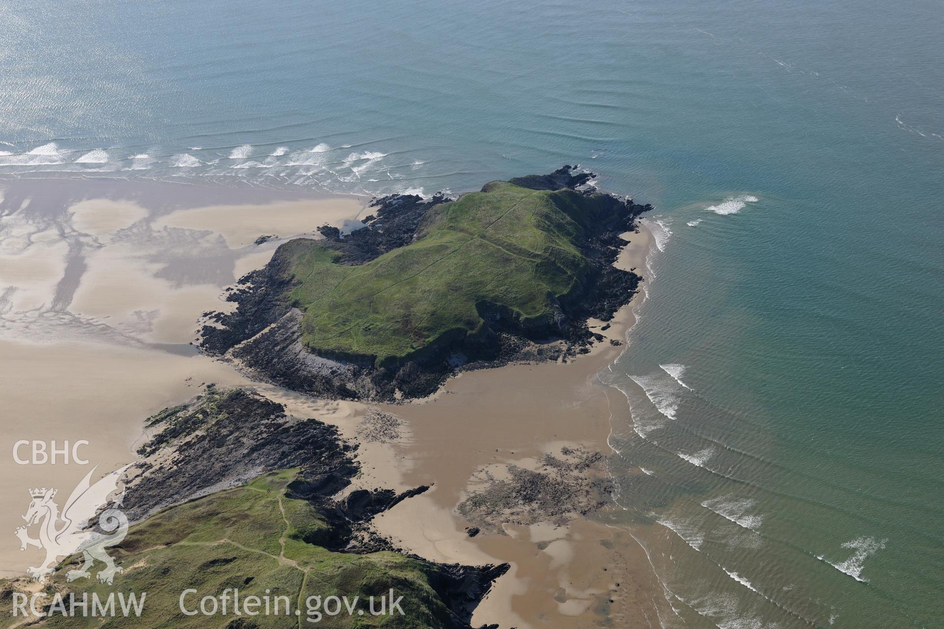 Burry Holms, with its promontory fort and medieval hermitage site, on the western coast of the Gower Peninsula. Oblique aerial photograph taken during the Royal Commission's programme of archaeological aerial reconnaissance by Toby Driver on 30th September 2015.