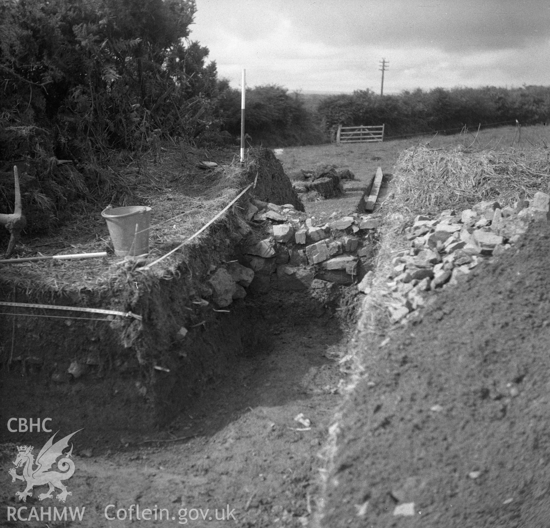 Digital copy of a nitrate negative showing excavation at Knock Rath, Clarbeston, 1963.