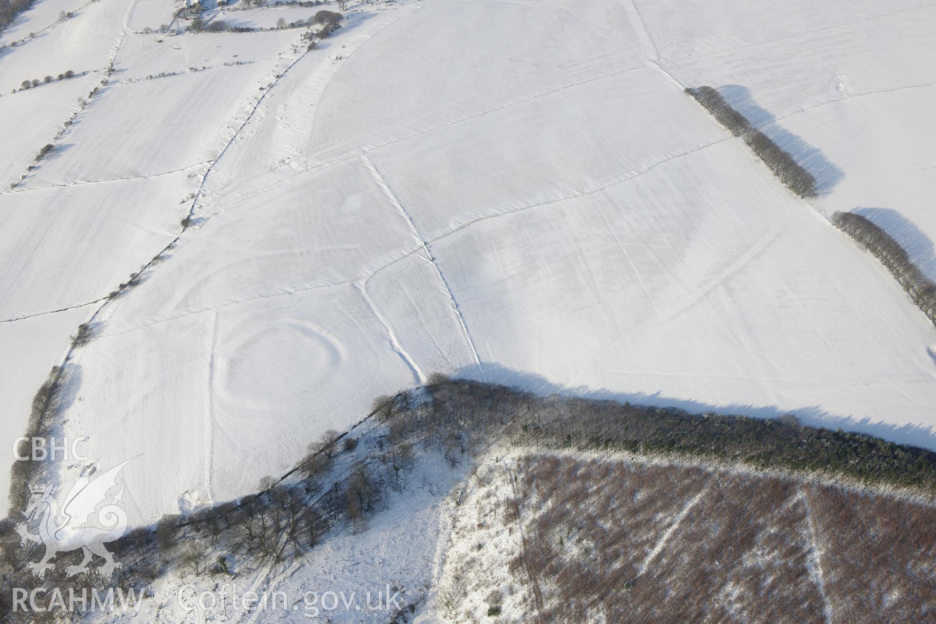 Ton Mawr enclosure, east of Margam, Port Talbot. Oblique aerial photograph taken during the Royal Commission?s programme of archaeological aerial reconnaissance by Toby Driver on 24th January 2013.