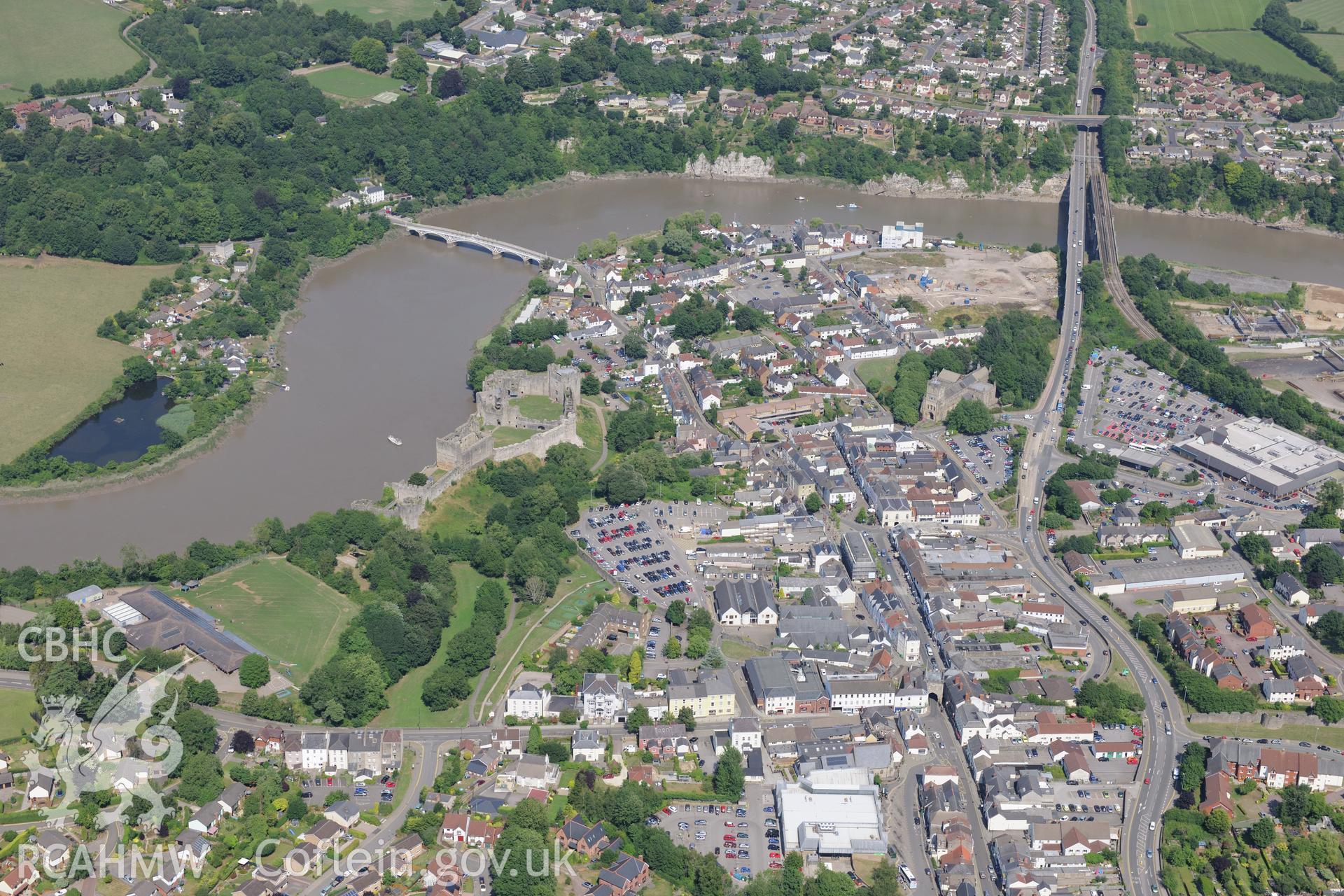 Chepstow Castle, and Chepstow Old Bridge and former A48 road bridge, crossing the river Wye in Chepstow. Oblique aerial photograph taken during the Royal Commission?s programme of archaeological aerial reconnaissance by Toby Driver on 1st August 2013.