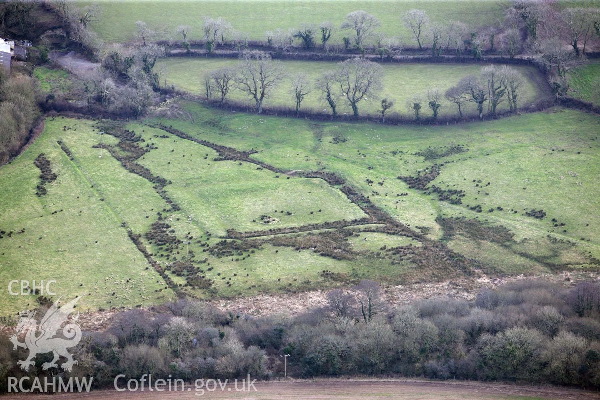 Merryborough moated site, north east of Haverfordwest. Oblique aerial photograph taken during the Royal Commission?s programme of archaeological aerial reconnaissance by Toby Driver on 28th February 2013.