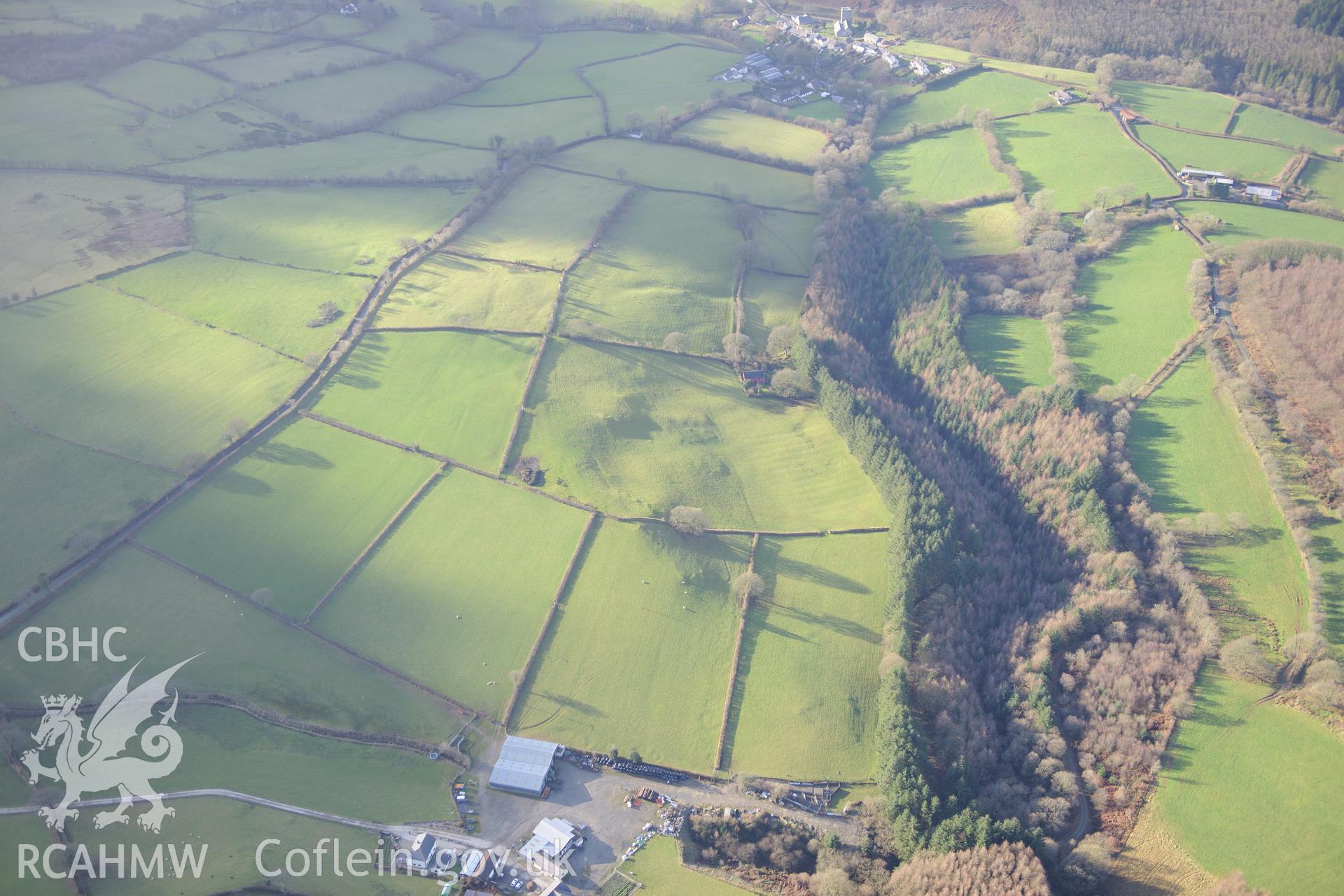 Caio Village and St Cynwyl's Church. Oblique aerial photograph taken during the Royal Commission's programme of archaeological aerial reconnaissance by Toby Driver on 6th January 2015.