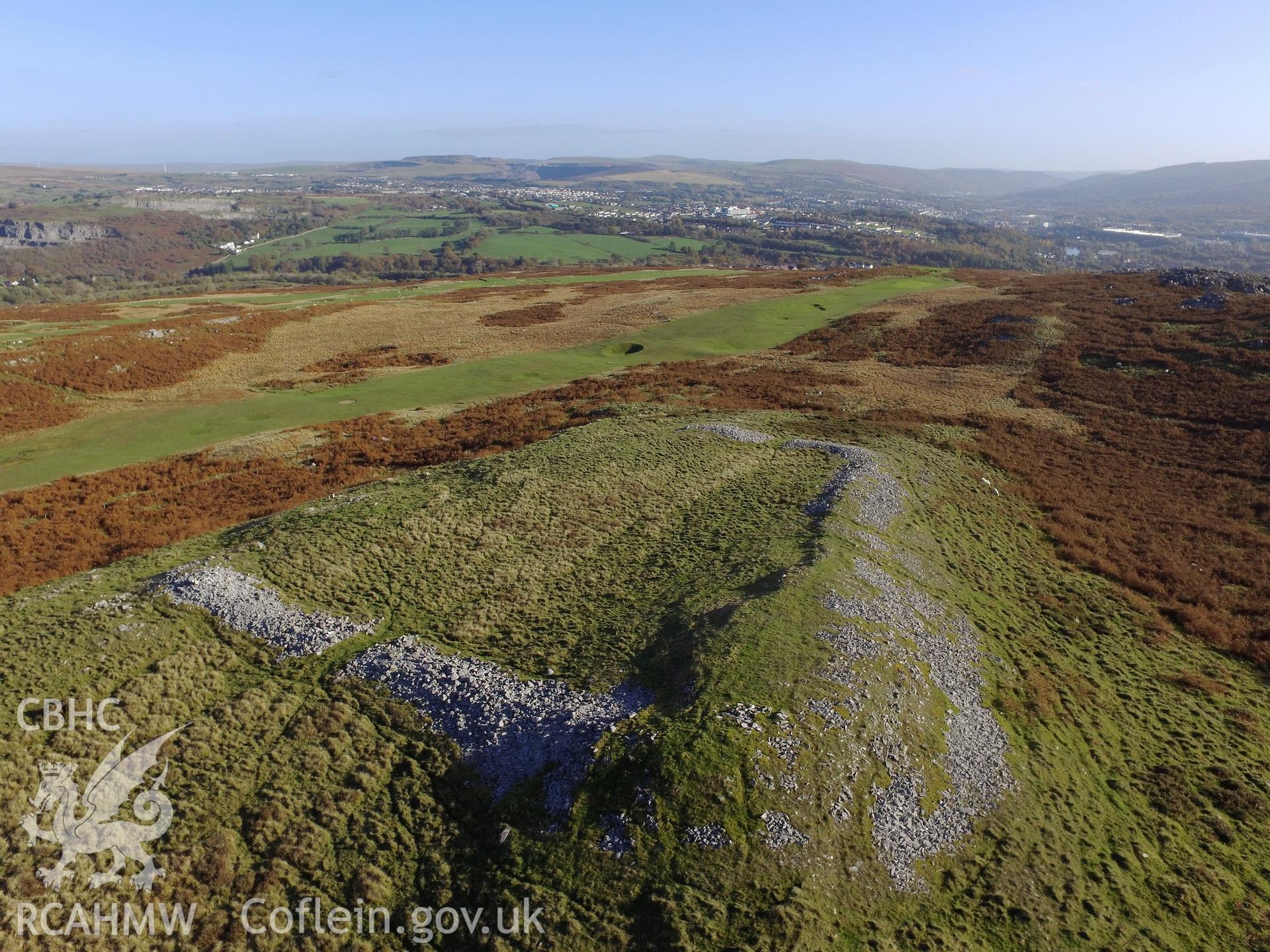 View from the north west of Cefn Cilsanws enclosure, Vaynor, with the town of Merthyr Tydfil beyond. Colour photograph taken by Paul R. Davis on 22nd October 2018.