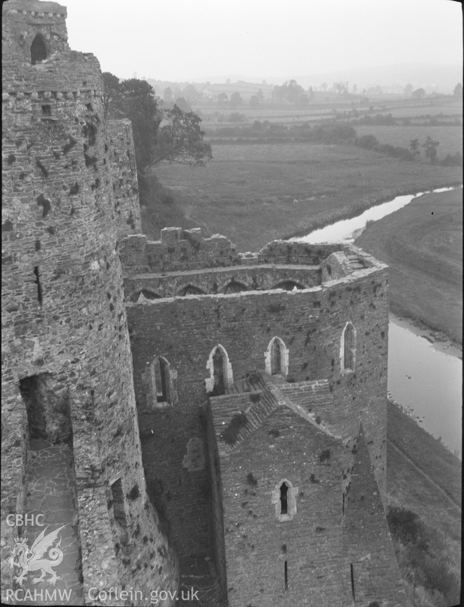 Digital copy of a nitrate negative showing exterior view of chapel, from the top of the south-east tower, Kidwelly Castle. From the National Building Record Postcard Collection.