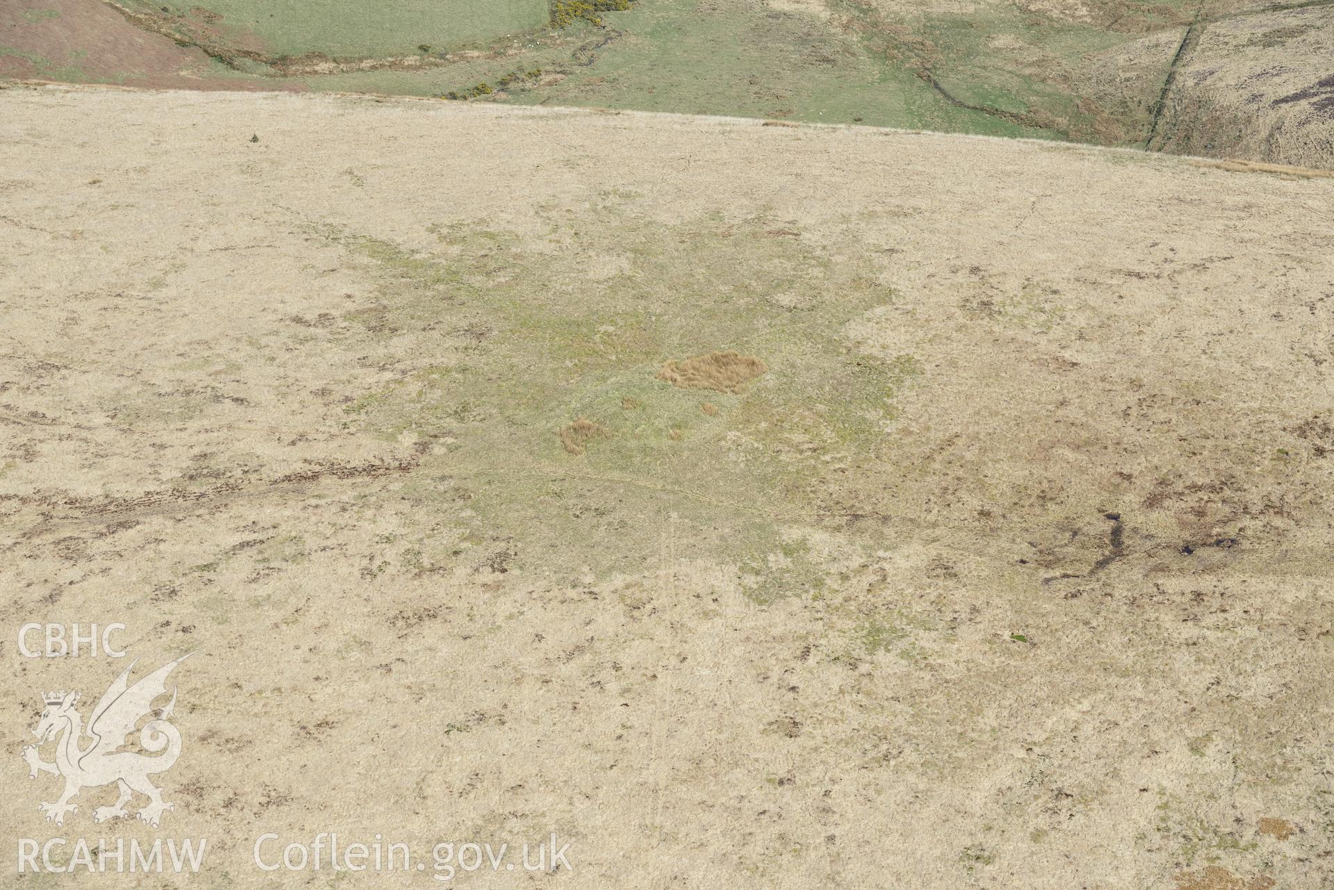 Foel Cwm-Cerwyn, Cairn 1. Oblique aerial photograph taken during the Royal Commission's programme of archaeological aerial reconnaissance by Toby Driver on 15th April 2015.'