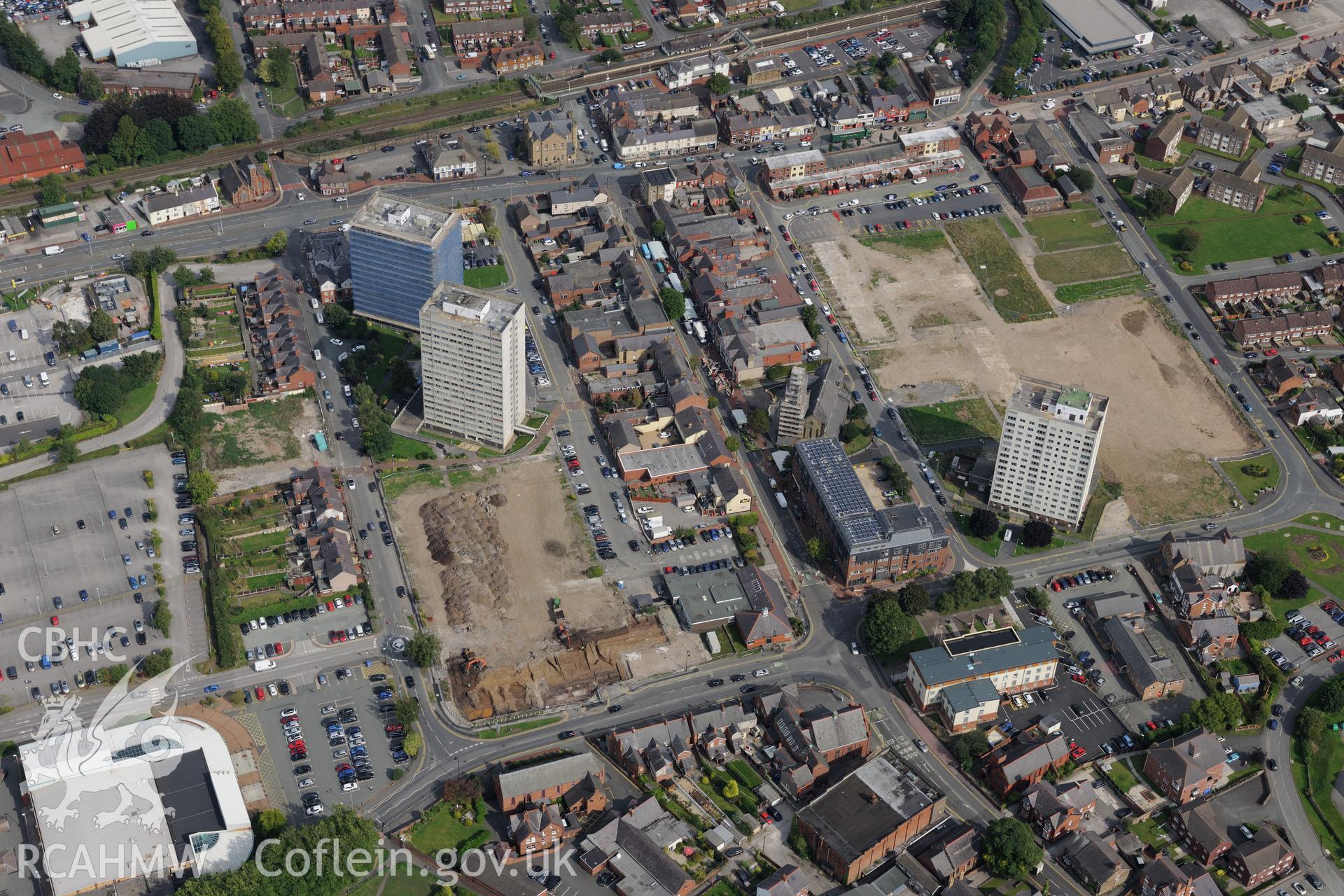 Flinshire Retail Centre on site of demolished housing estate, Flint. Oblique aerial photograph taken during the Royal Commission's programme of archaeological aerial reconnaissance by Toby Driver on 11th September 2015.