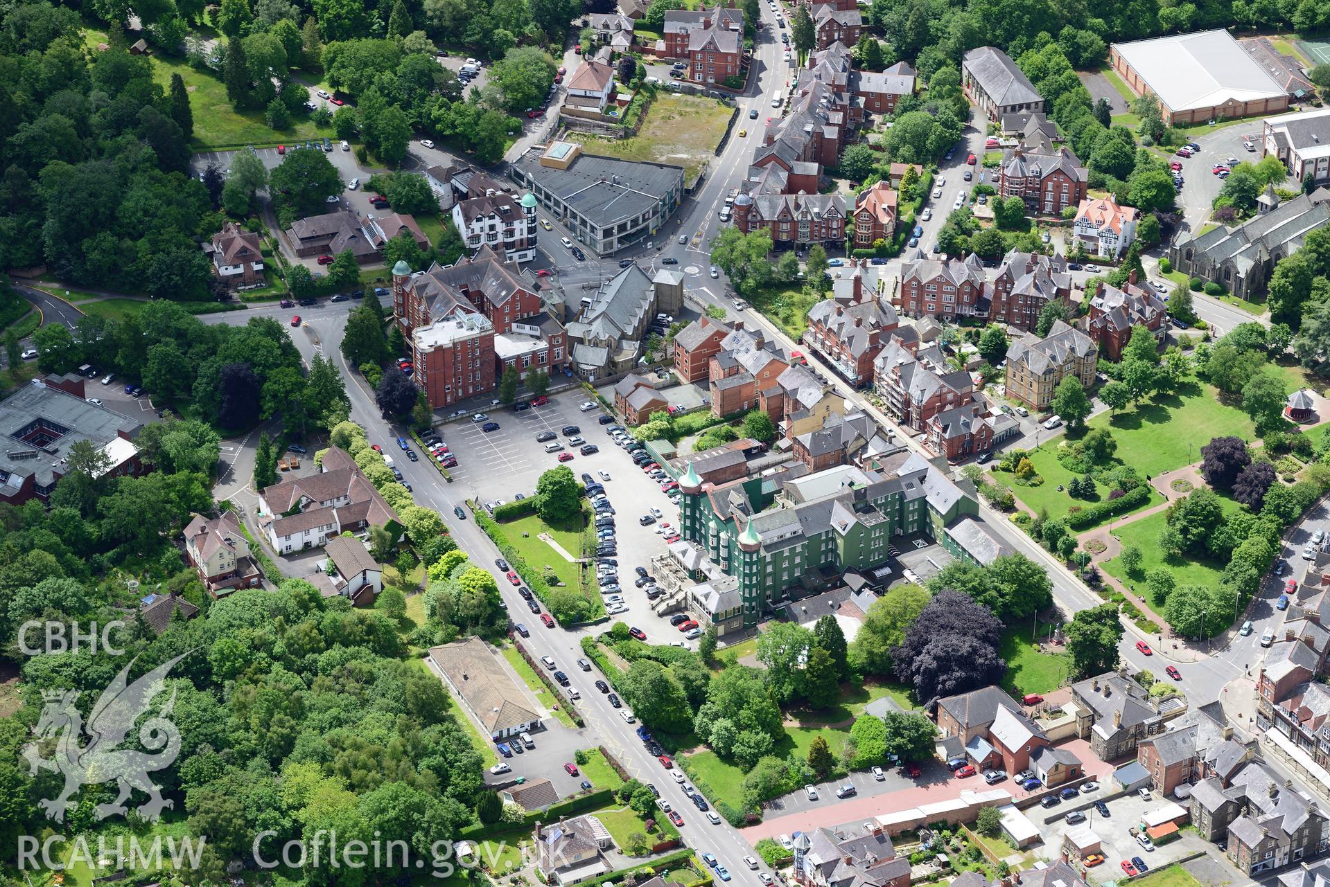 The Old County Club House and the former Metropole Hotel (now a further education college), Llandrindod Wells. Oblique aerial photograph taken during the Royal Commission's programme of archaeological aerial reconnaissance by Toby Driver on 30th June 2015.