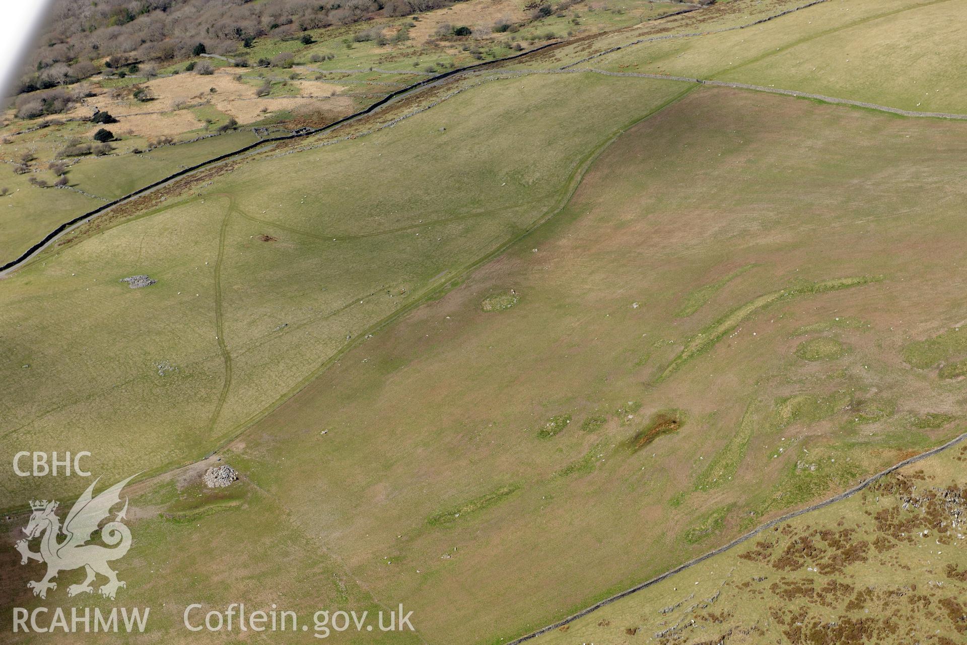 Cairn circles at Moel Goedog, Harlech. Oblique aerial photograph taken during the Royal Commission?s programme of archaeological aerial reconnaissance by Toby Driver on 1st May 2013.