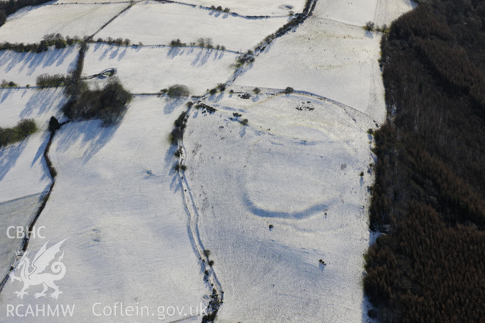 Twyn-y-Gaer enclosure, Defynnog, south east of Sennybridge. Oblique aerial photograph taken during the Royal Commission?s programme of archaeological aerial reconnaissance by Toby Driver on 15th January 2013.