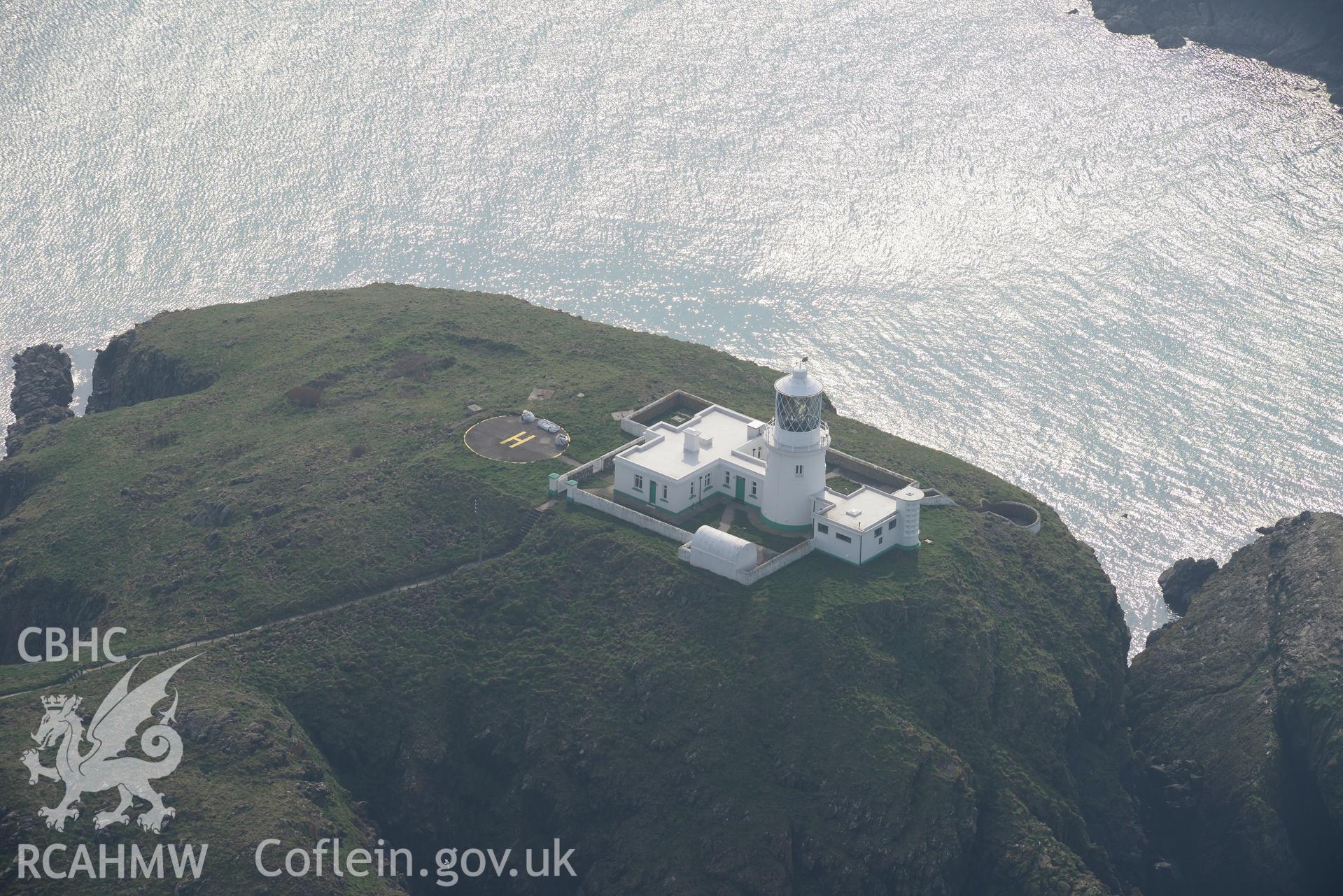 Aerial photography of Strumble Head lighthouse taken on 27th March 2017. Baseline aerial reconnaissance survey for the CHERISH Project. ? Crown: CHERISH PROJECT 2017. Produced with EU funds through the Ireland Wales Co-operation Programme 2014-2020. All material made freely available through the Open Government Licence.