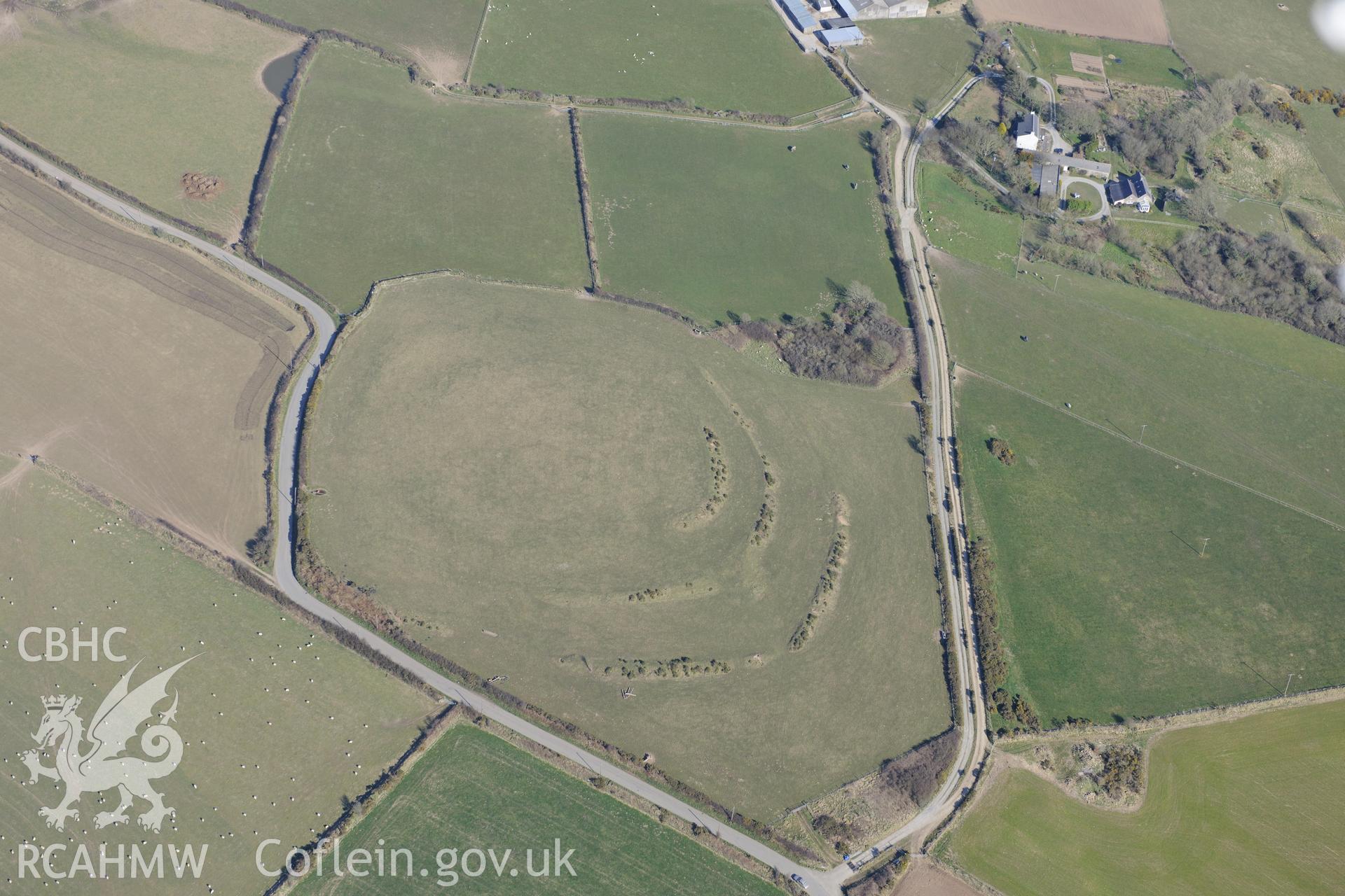 Caerau Gaer defended enclosure, Moylgrove, west of Cardigan. Oblique aerial photograph taken during the Royal Commission's programme of archaeological aerial reconnaissance by Toby Driver on 2nd April 2013.