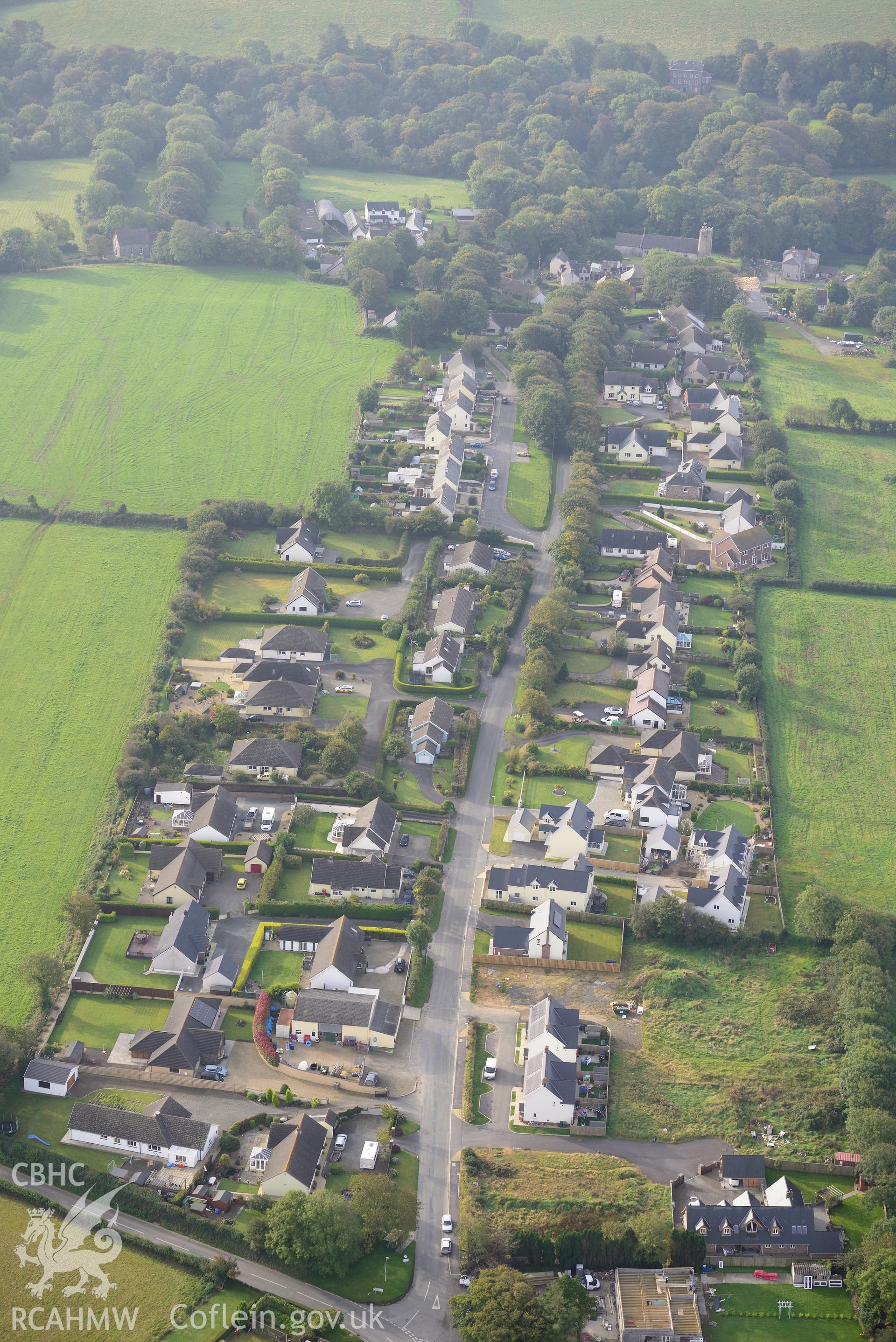 The village of Camrose, near Haverford West. Oblique aerial photograph taken during the Royal Commission's programme of archaeological aerial reconnaissance by Toby Driver on 29th September 2015.