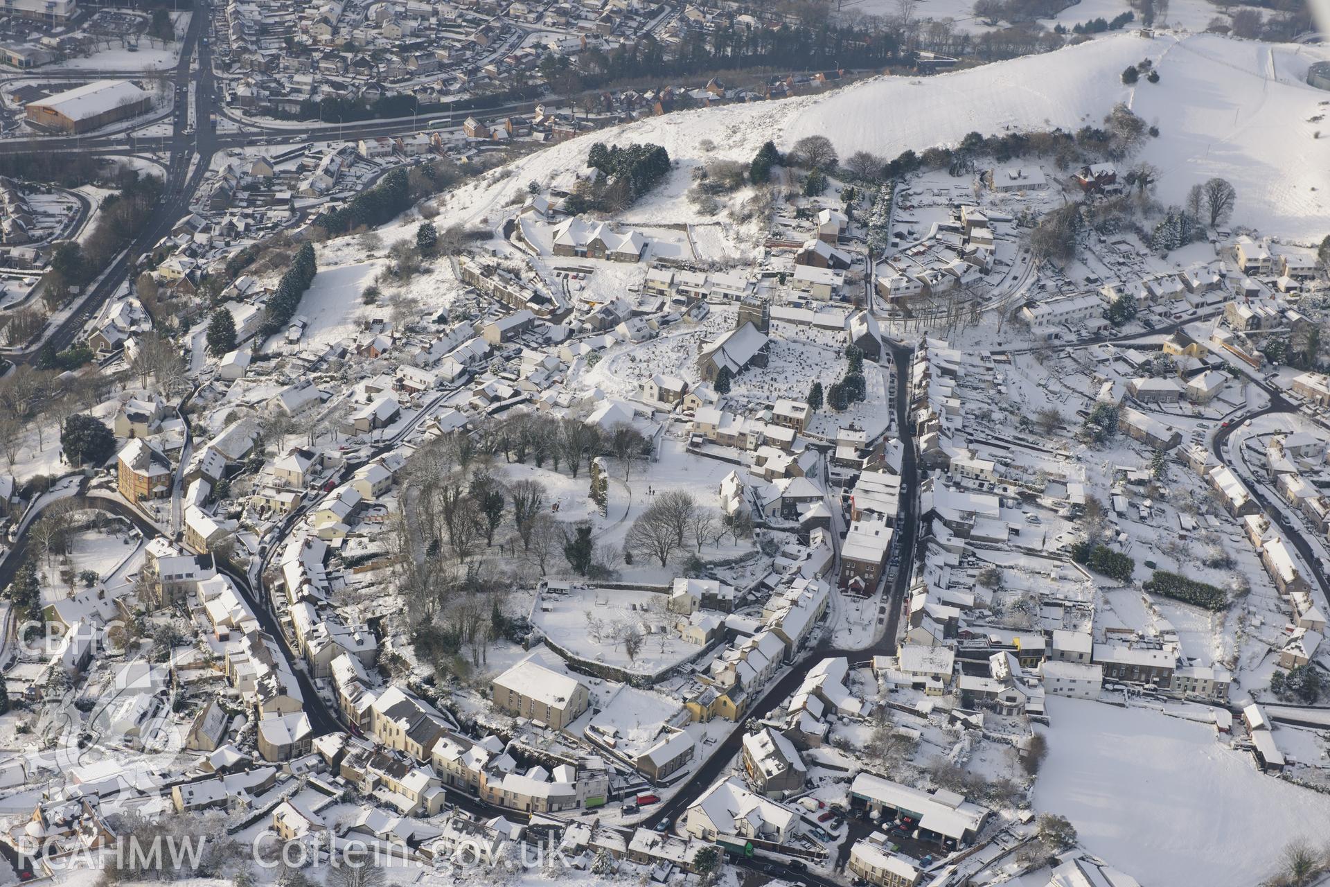 The church of Saints Illtyd, Gwyno and Tyfodwg, and Llantrisant Castle, Llantrisant, north west of Cardiff. Oblique aerial photograph taken during the Royal Commission?s programme of archaeological aerial reconnaissance by Toby Driver on 24th January 2013.