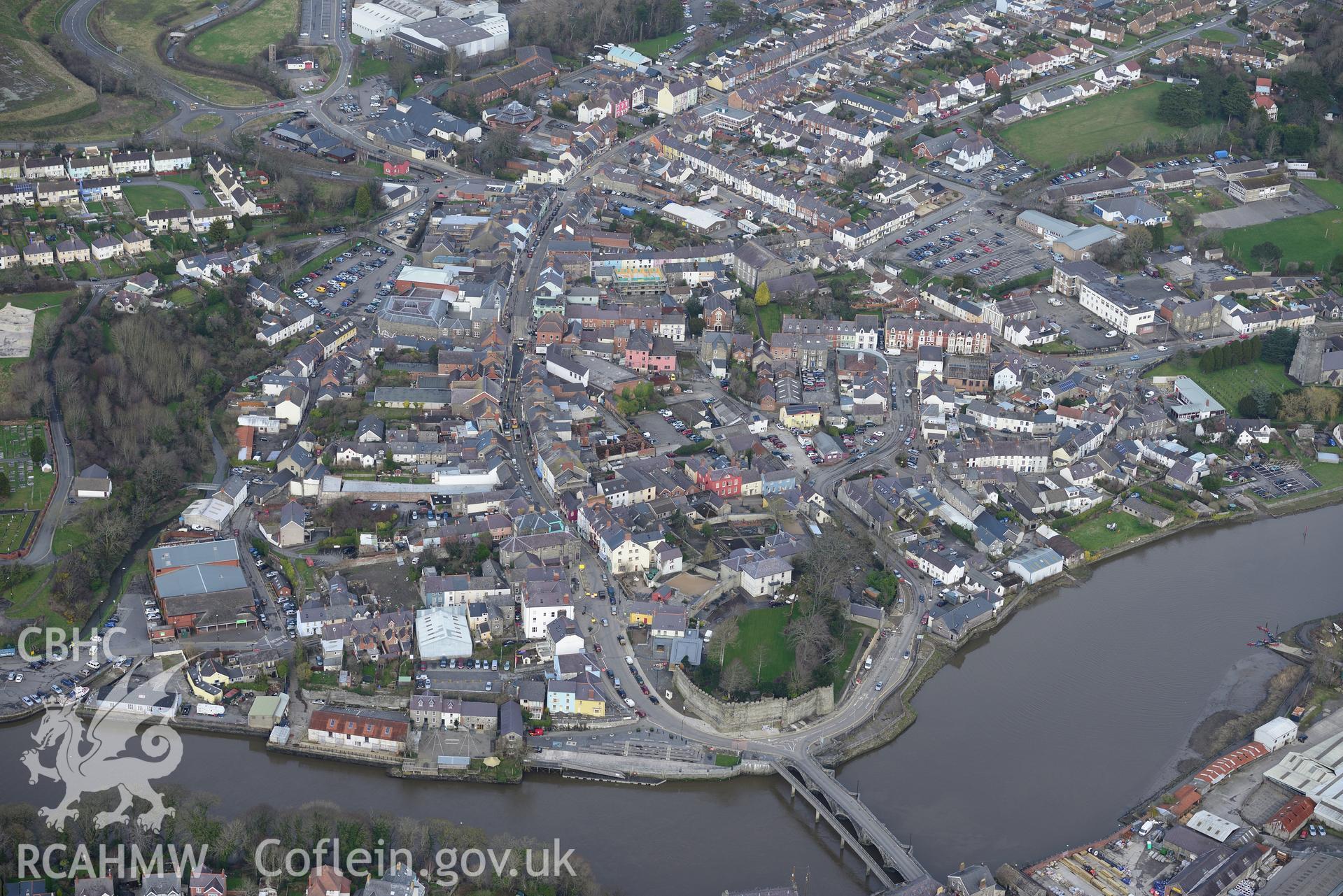 Cardigan bridge, Cardigan castle, and the castle house, garden and stables, Cardigan. Oblique aerial photograph taken during the Royal Commission's programme of archaeological aerial reconnaissance by Toby Driver on 13th March 2015.