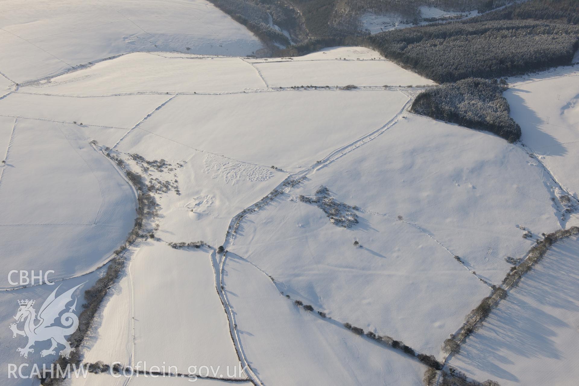 Maes Cadlawr British fortified residence, north west of Bridgend. Oblique aerial photograph taken during the Royal Commission?s programme of archaeological aerial reconnaissance by Toby Driver on 24th January 2013.