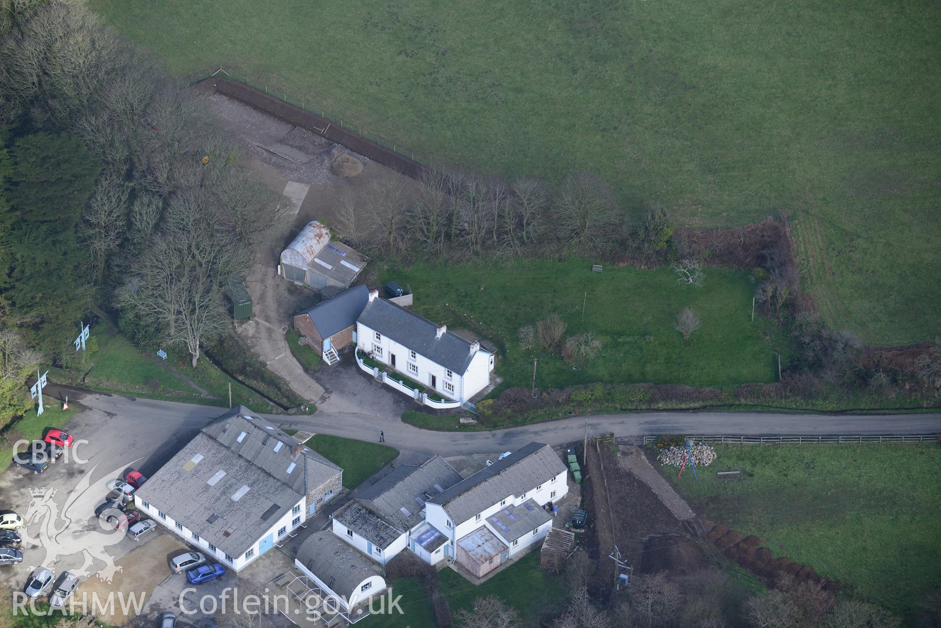 Melin Tregwynt woollen mill and Tre-Gwynt garden, Tremarchog, near Fishguard. Oblique aerial photograph taken during the Royal Commission's programme of archaeological aerial reconnaissance by Toby Driver on 13th March 2015.