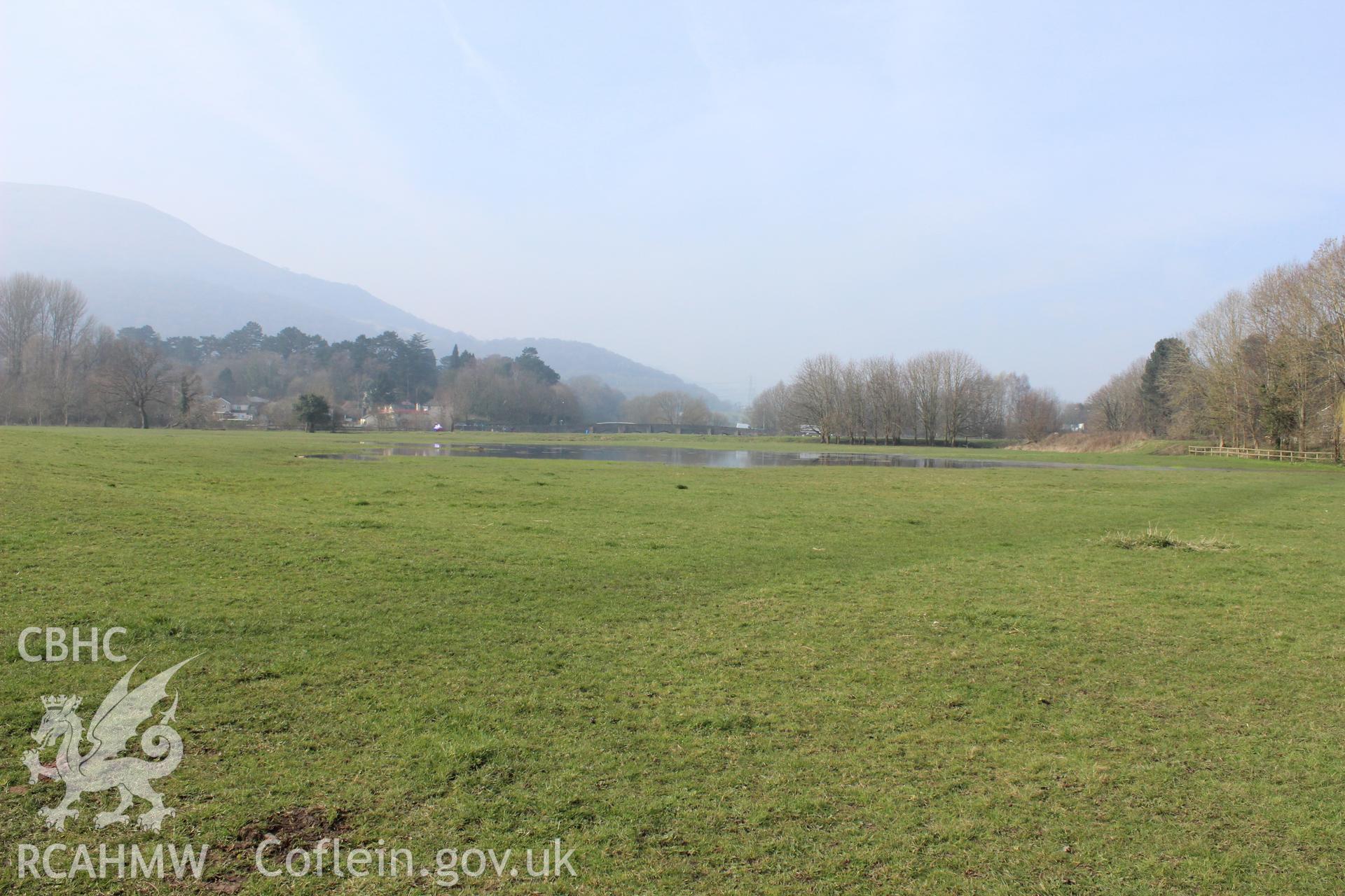 Marshy area with puddle in field at proposed Eisteddfod site. Photographed on site visit for archaeological desk based assessment of the proposed Eisteddfod Site at Castle Meadows and Llanfoist, Abergavenny, carried out by Archaeology Wales, 2014.