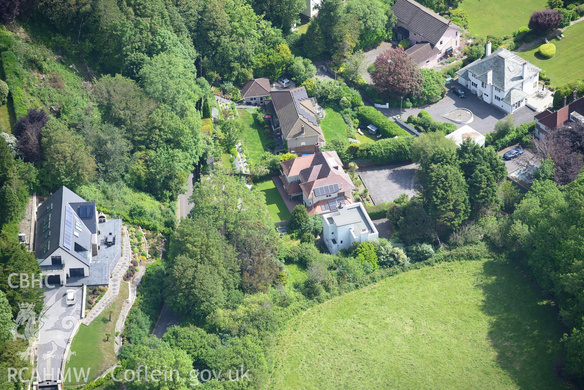 Housing at Caswell Bay. Oblique aerial photograph taken during the Royal Commission's programme of archaeological aerial reconnaissance by Toby Driver on 19th June 2015.