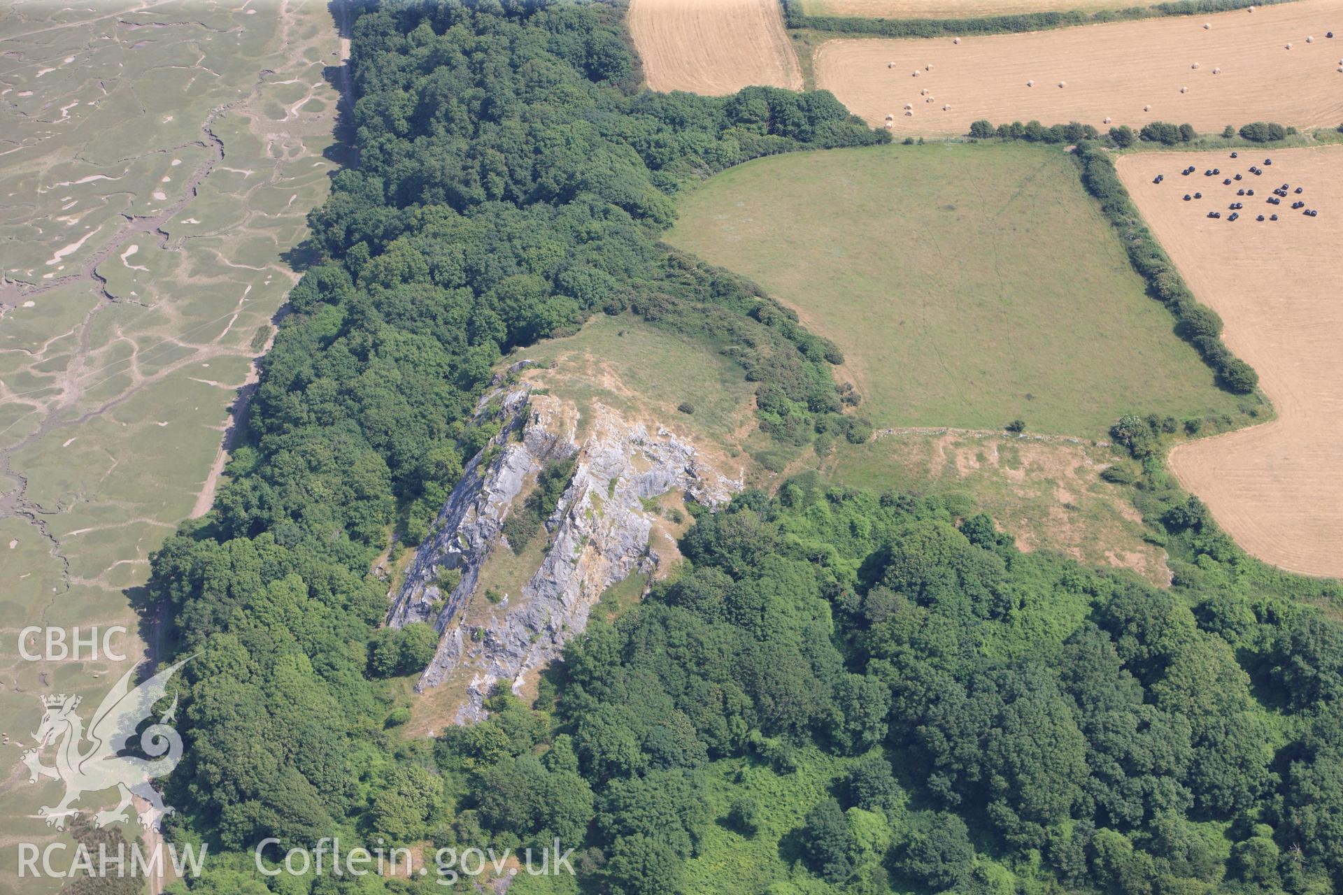 North Hill Tor defended enclosure, on the Gower Peninsula. Oblique aerial photograph taken during the Royal Commission?s programme of archaeological aerial reconnaissance by Toby Driver on 16th July 2013.