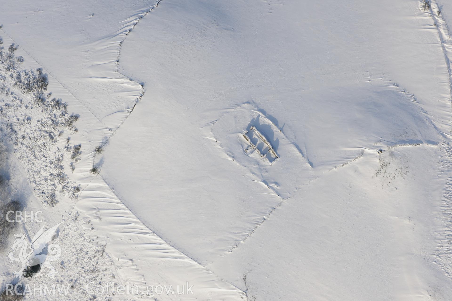 Remains of St. Peter's church, Llanbad, north of Llanharan, Bridgend. Oblique aerial photograph taken during the Royal Commission?s programme of archaeological aerial reconnaissance by Toby Driver on 24th January 2013.