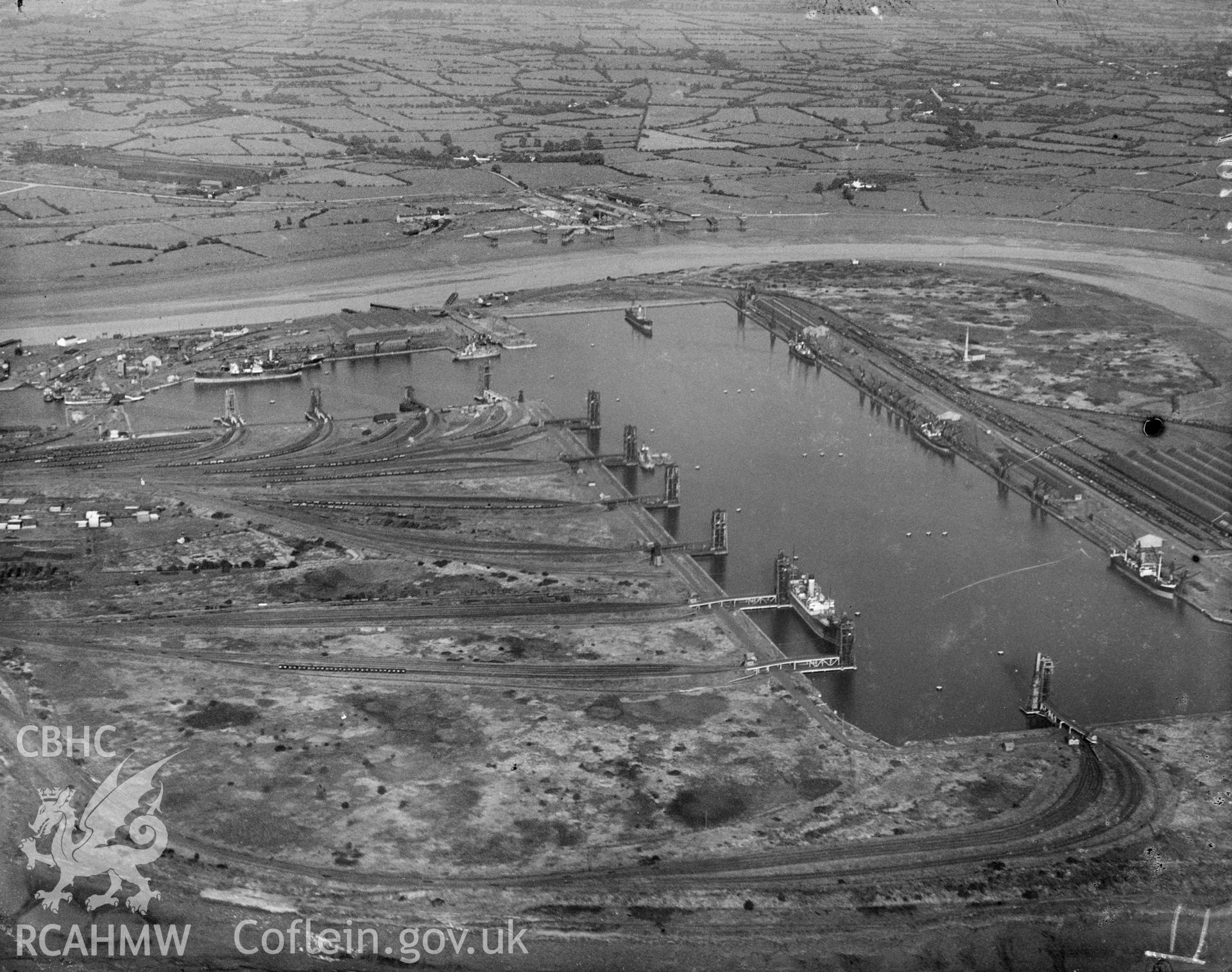 Black and white oblique aerial photograph showing Newport Docks, from Aerofilms album Monmouthshire N-Pe, taken by Aerofilms Ltd and dated 1928.