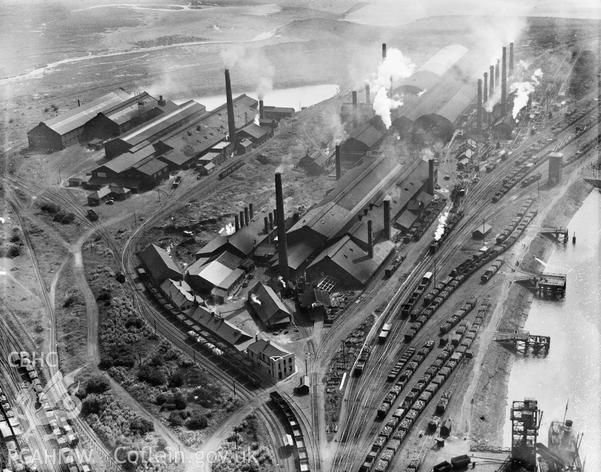 View of Baglan Bay tinplate works, Whitford and Albion works, Briton Ferry from the north, oblique aerial view. 5?x4? black and white glass plate negative.