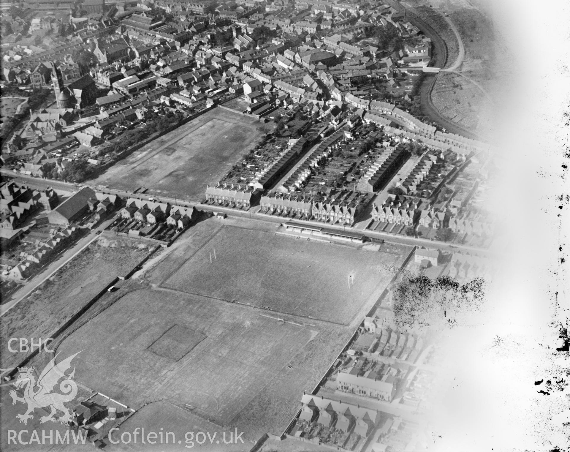 View of the Gnoll rugby and cricket grounds, Neath, oblique aerial view. 5?x4? black and white glass plate negative.