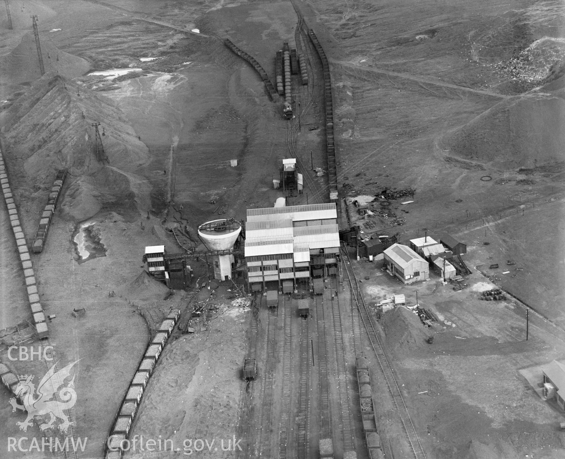 Digital copy of a black and white, oblique aerial photograph of Onllwyn Coal Washery. The photograph shows the view from the North West, showing the coal screens and conical washery tower.