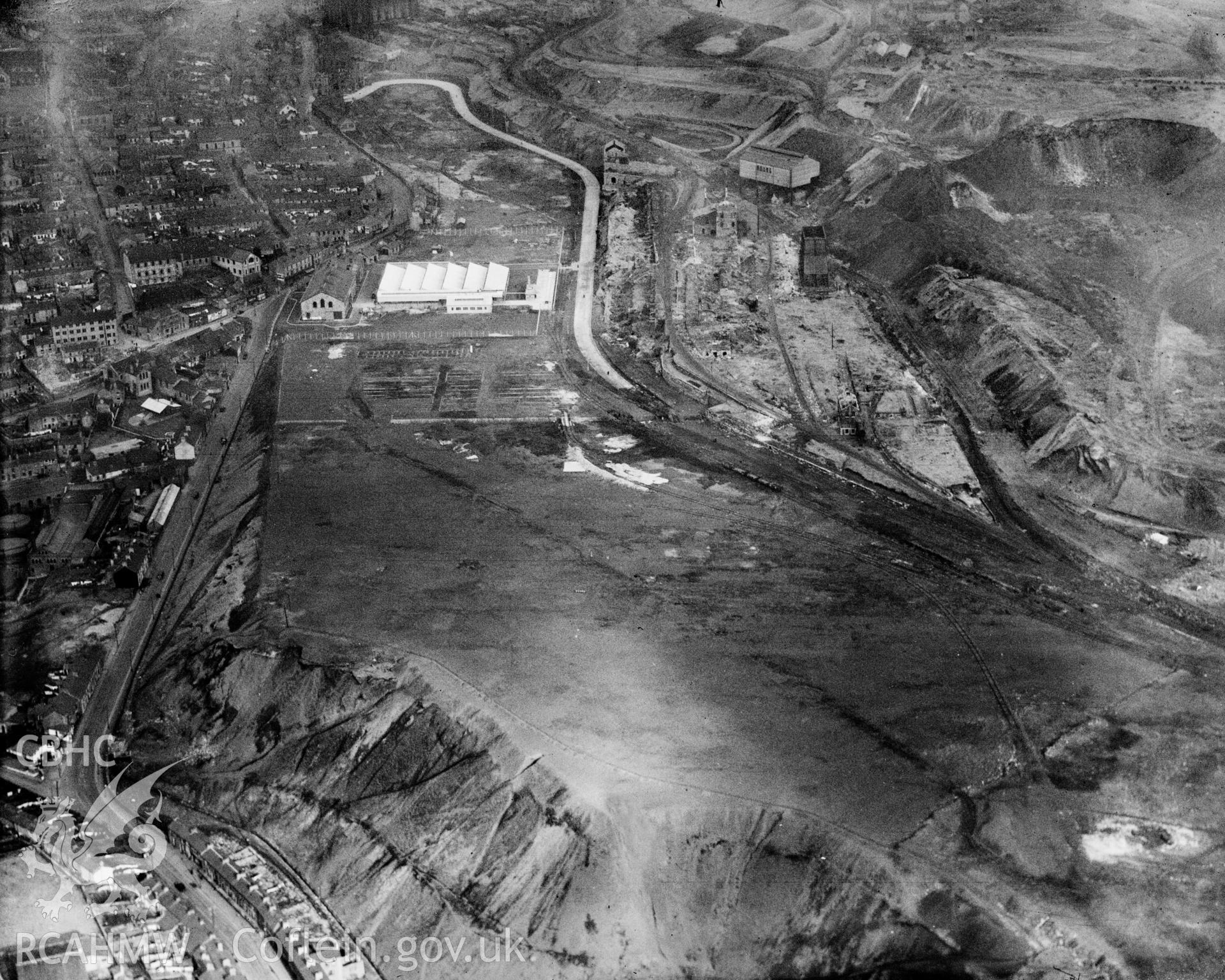 View of Dowlais Ironworks showing Dowlais great tip, oblique aerial view. 5?x4? black and white glass plate negative.