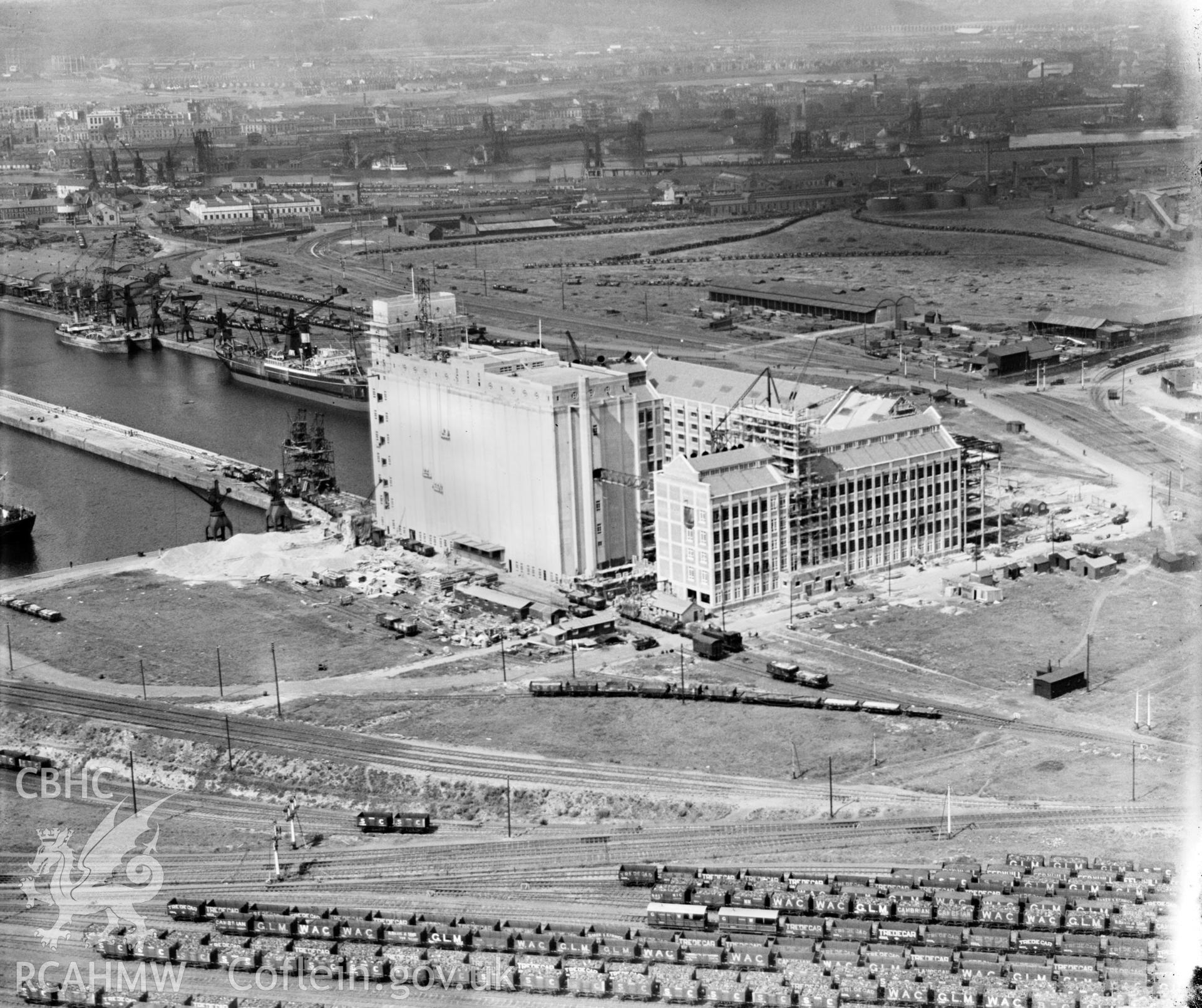 View of construction of Spillers Flour Mill, Clipper Road, Roath Dock, Cardiff, oblique aerial view. 5?x4? black and white glass plate negative.