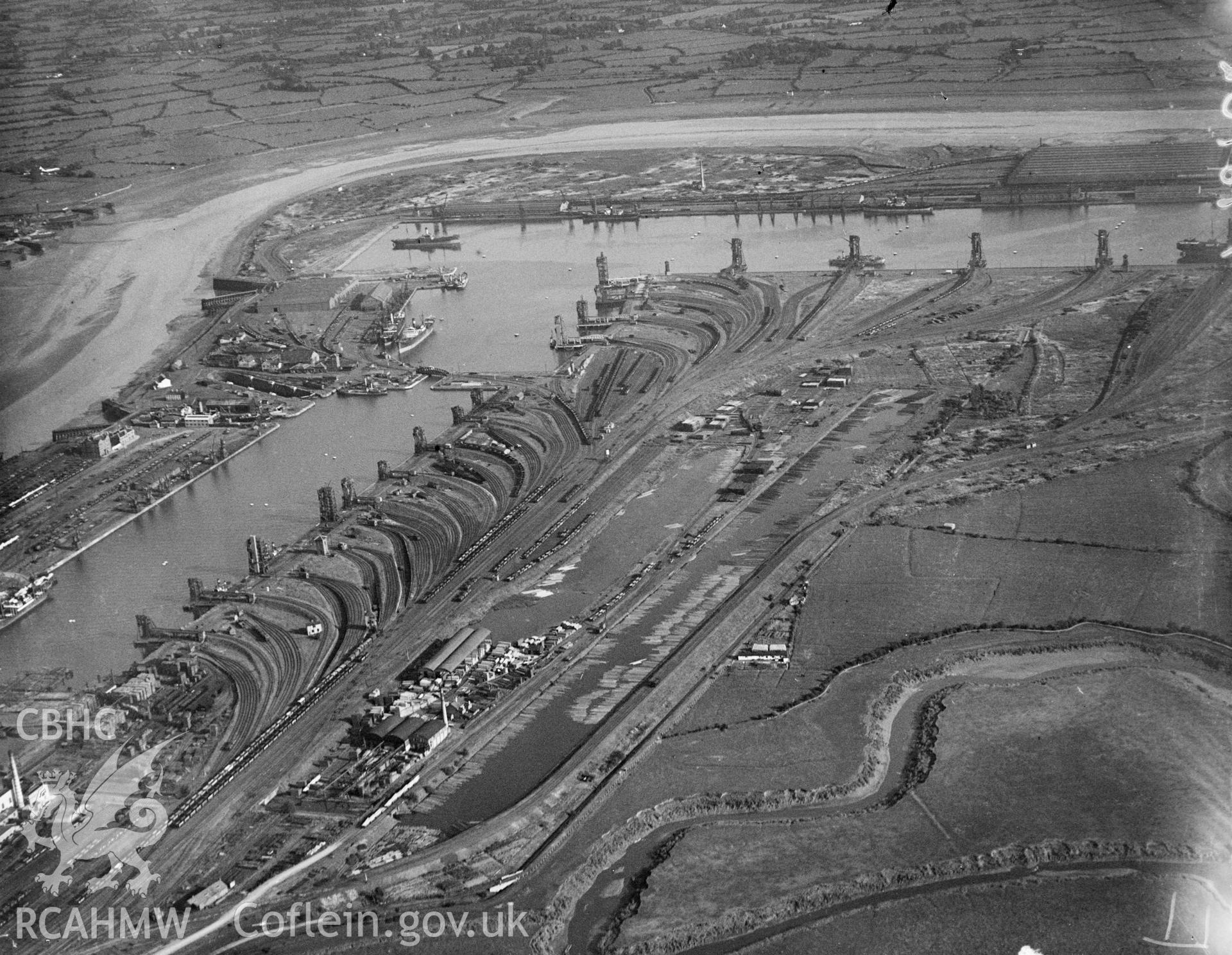 Black and white oblique aerial photograph showing Newport Docks, from Aerofilms album Monmouthshire N-Pe, taken by Aerofilms Ltd and dated 1928.