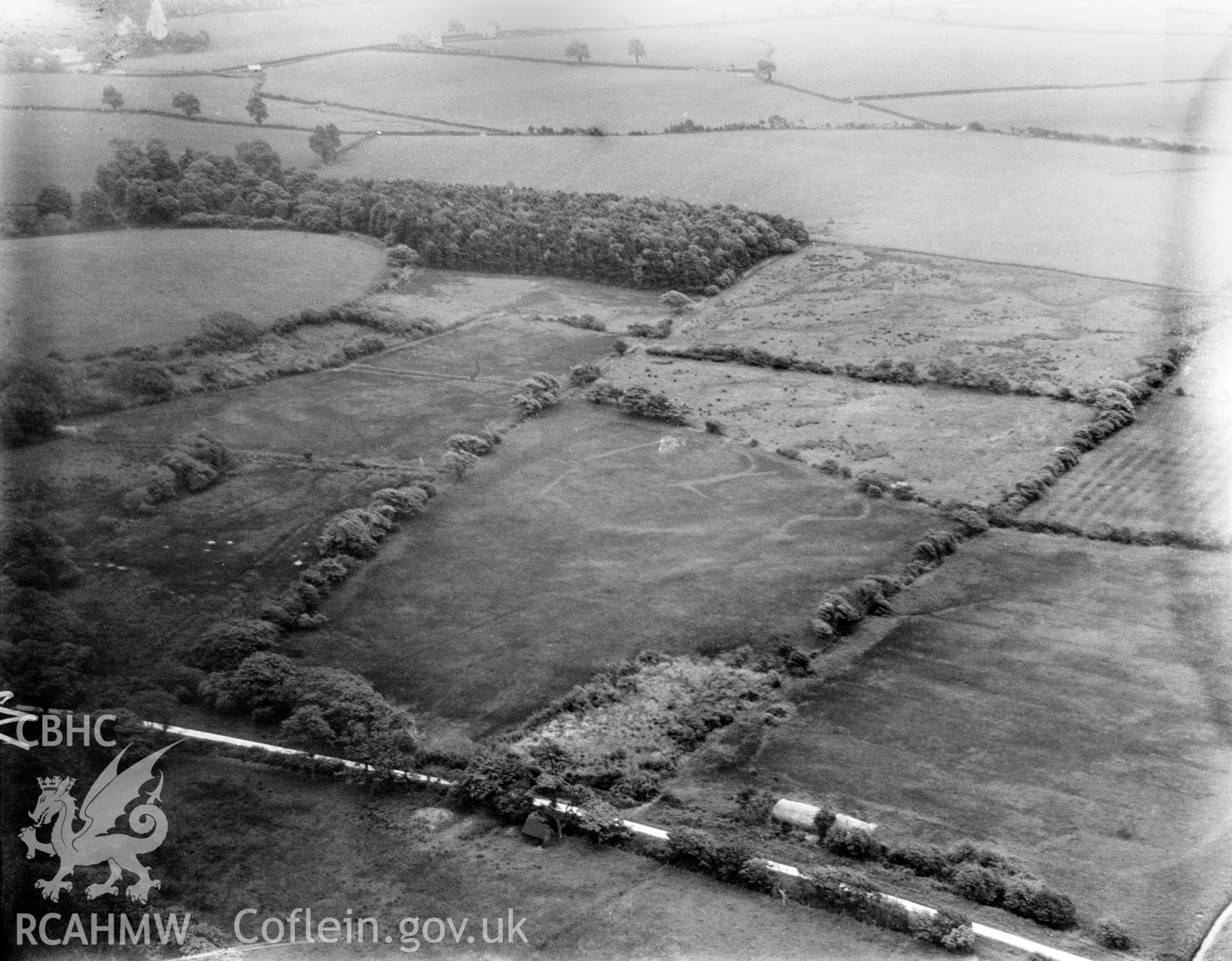 Showing area south west of Margam, including the Ropeyard Plantation and Upper Mother Ditch. Now the site of Eglwys Nunydd Reservoir, oblique aerial view. 5?x4? black and white glass plate negative.