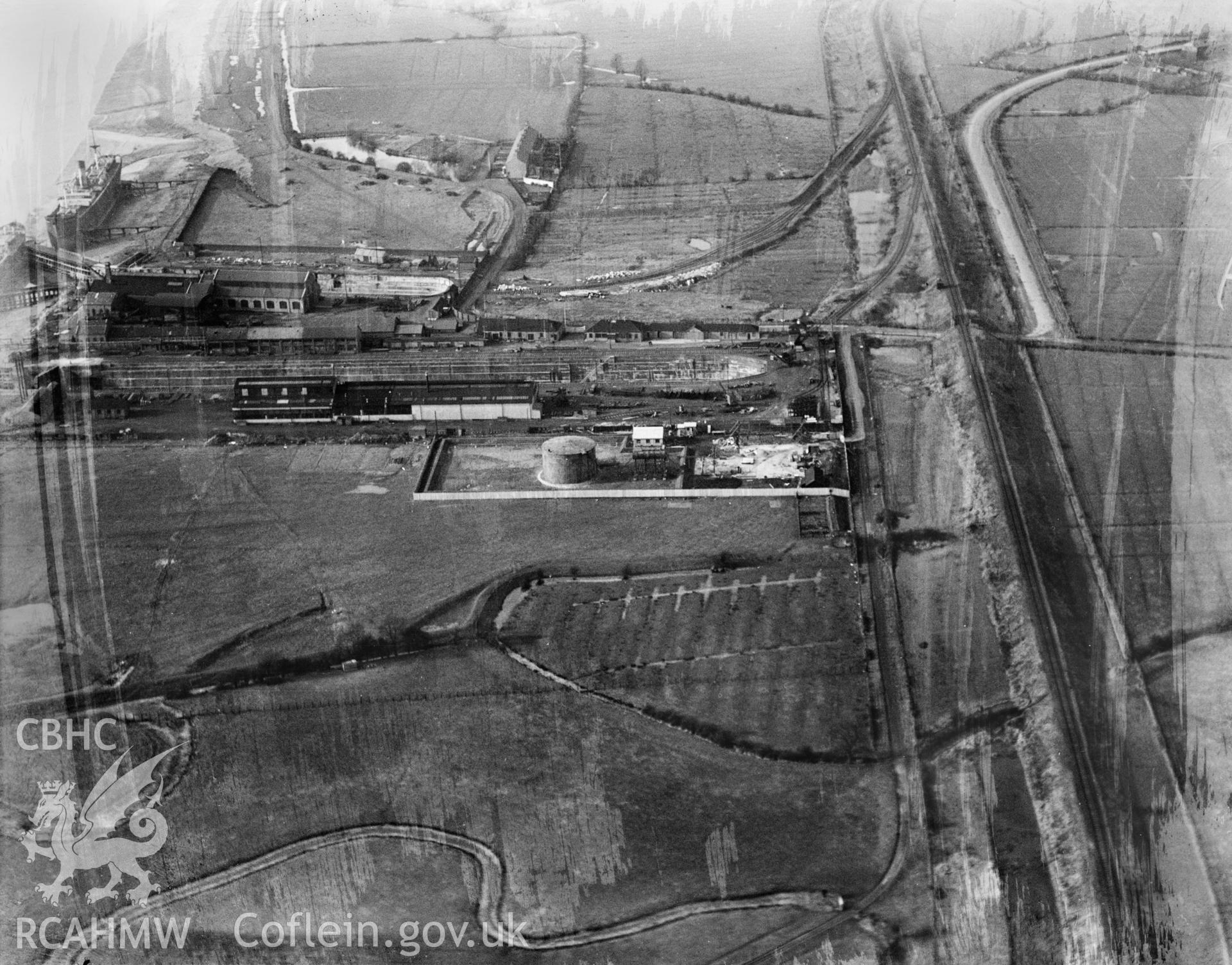 View of British Oil Storage Co., Union Dry Dock, Newport, oblique aerial view. 5?x4? black and white glass plate negative.