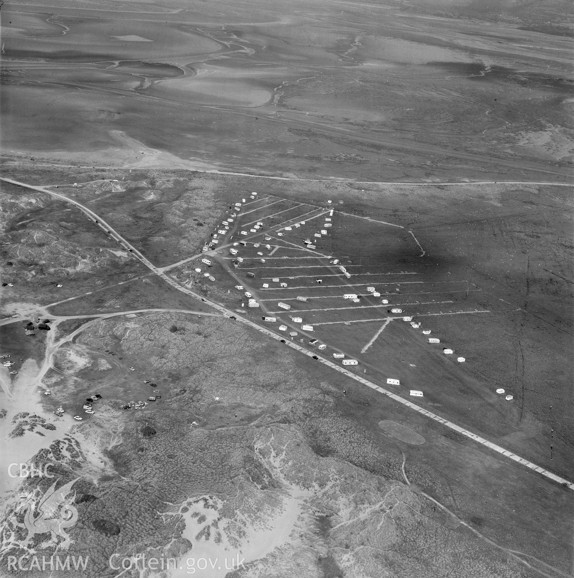 Black and white oblique aerial photograph showing caravans at Ynyslas, from Aerofilms album Cardiganshire no W30, taken by Aerofilms Ltd and dated 1962.