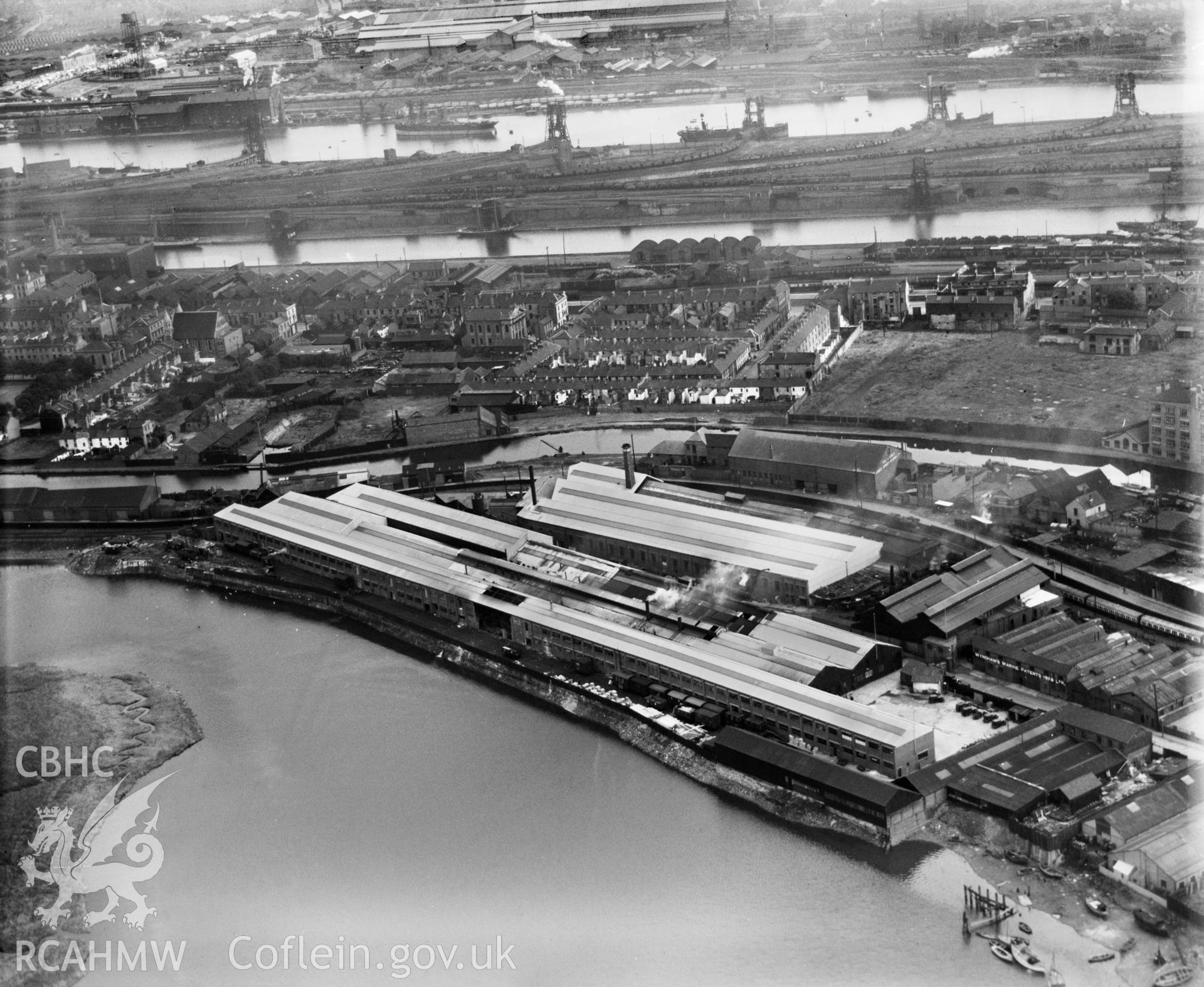 Distant view of Bute Ironworks, Cardiff, showing the river Taff and the Glamorganshire canal, oblique aerial view. 5?x4? black and white glass plate negative.