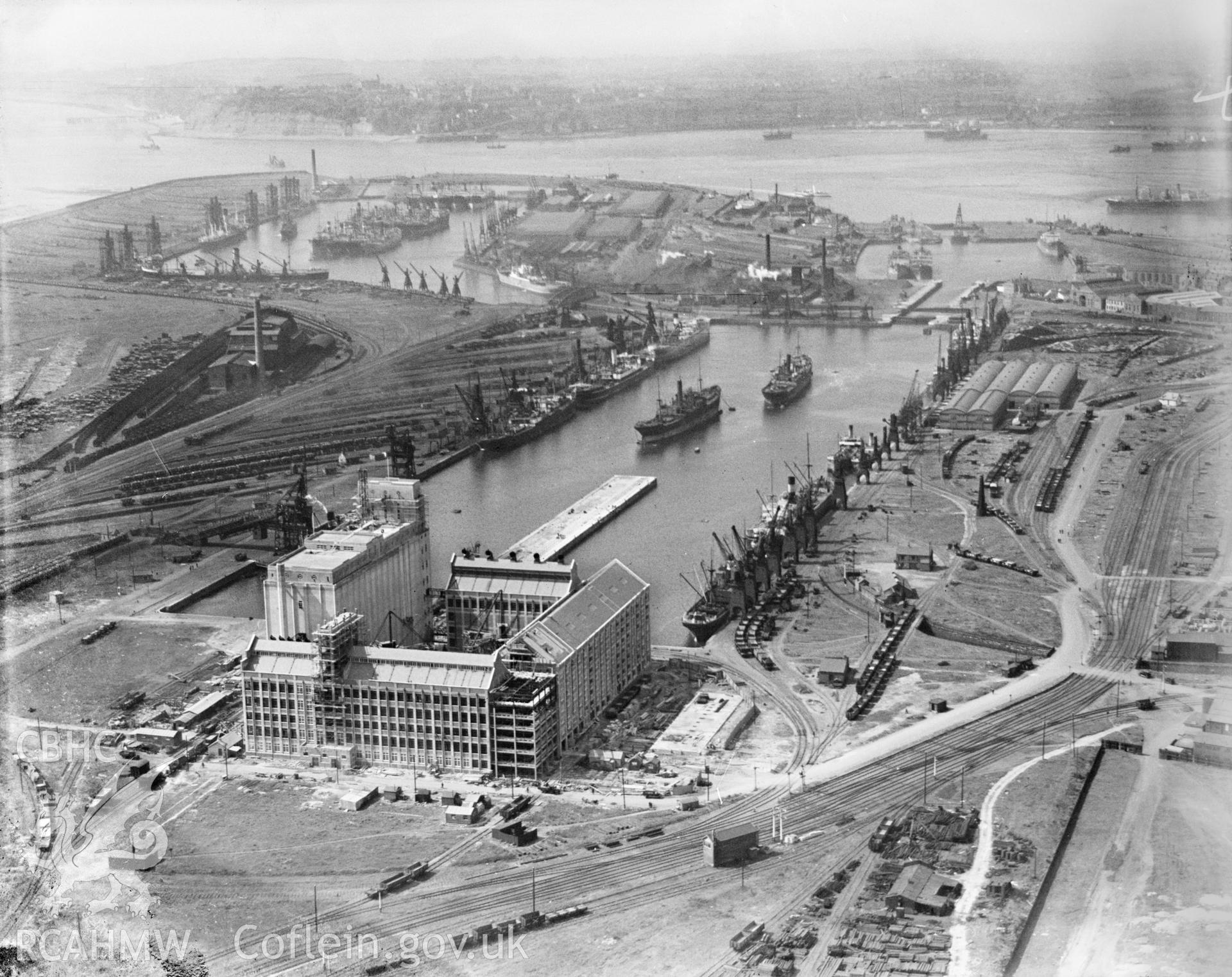 View of construction of Spillers Flour Mill, Clipper Road, Roath Dock, Cardiff, oblique aerial view. 5?x4? black and white glass plate negative.