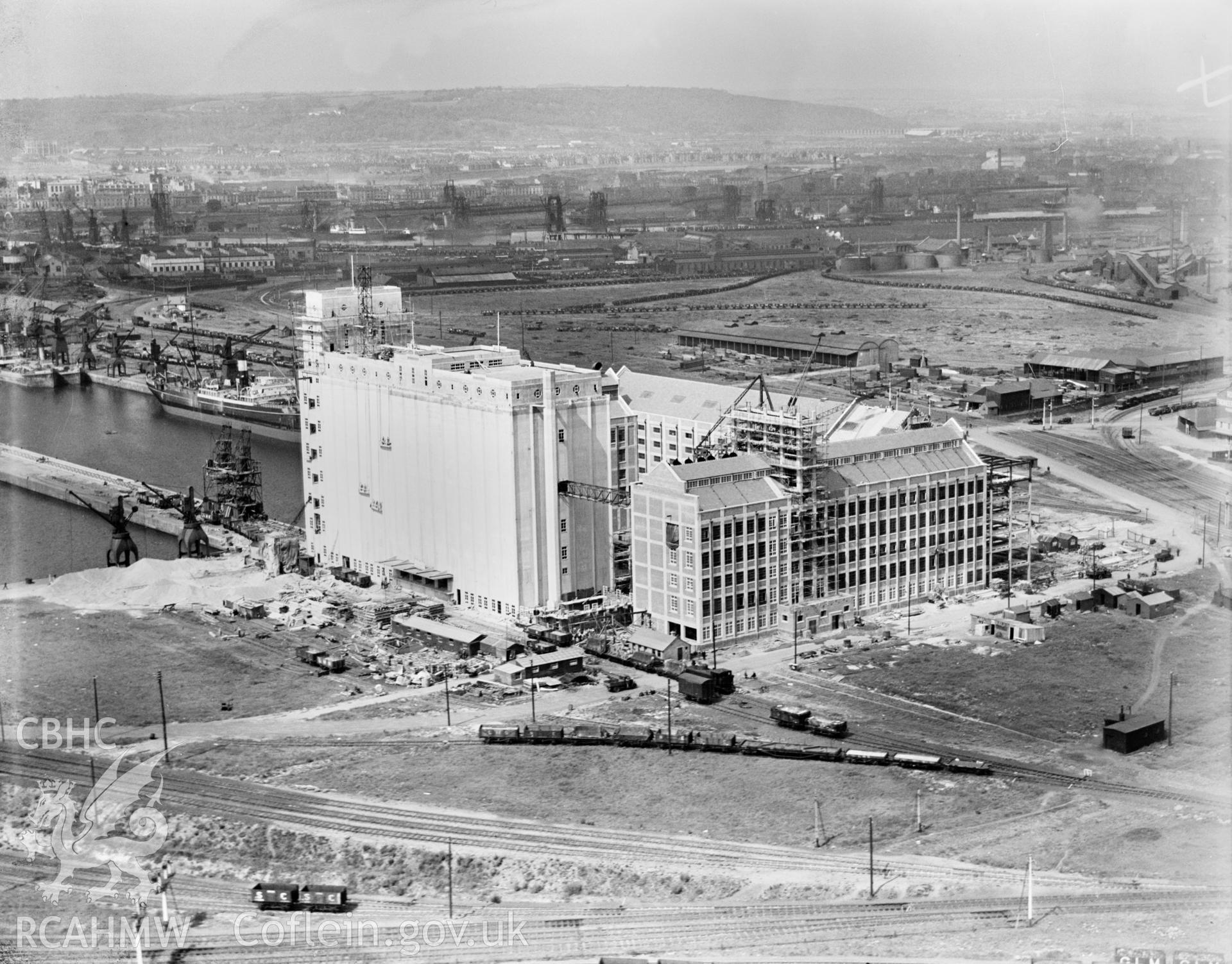 View of construction of Spillers Flour Mill, Clipper Road, Roath Dock, Cardiff, oblique aerial view. 5?x4? black and white glass plate negative.