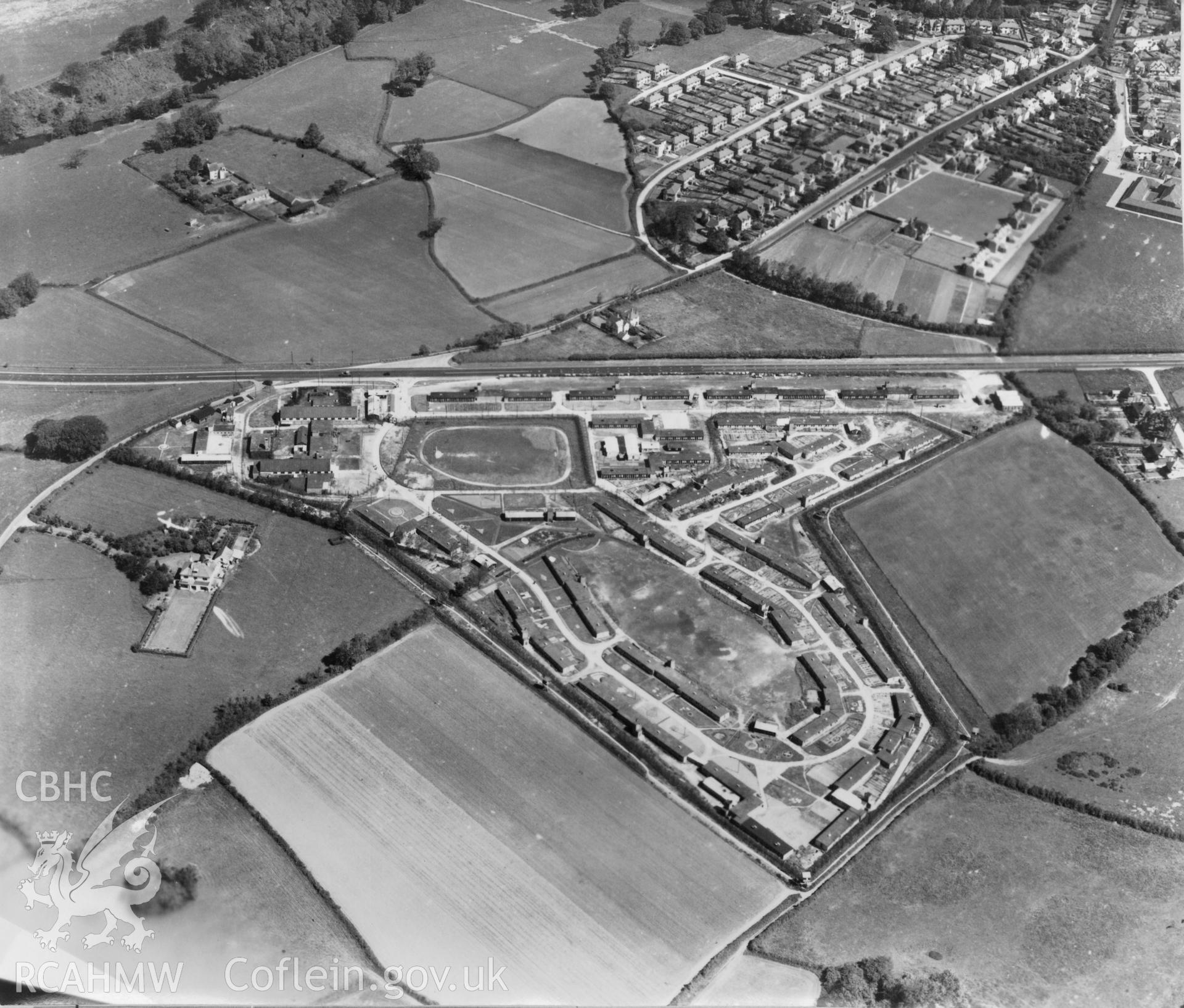 Black and white oblique aerial photograph showing Bridgend Island Farm Prisoner of War Camp, from Aerofilms album no W18 (Glamorgan A-B), taken by Aerofilms Ltd and dated 1947.