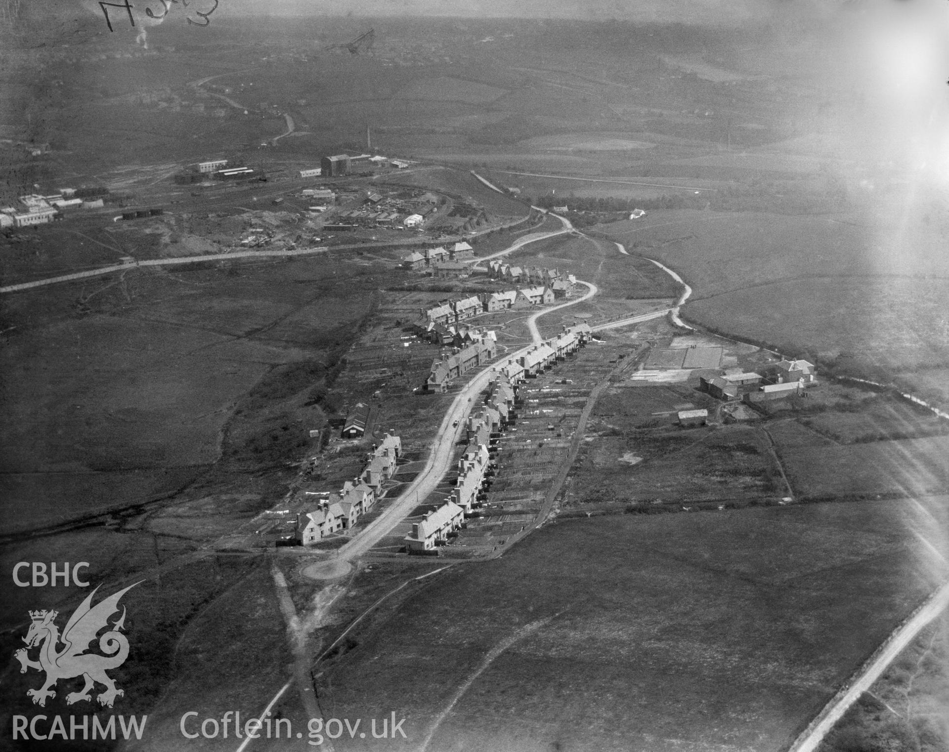 Black and white oblique aerial photograph showing Llandarcy Village from Aerofilms album no. W.30, taken by Aerofilms Ltd and dated 1923.