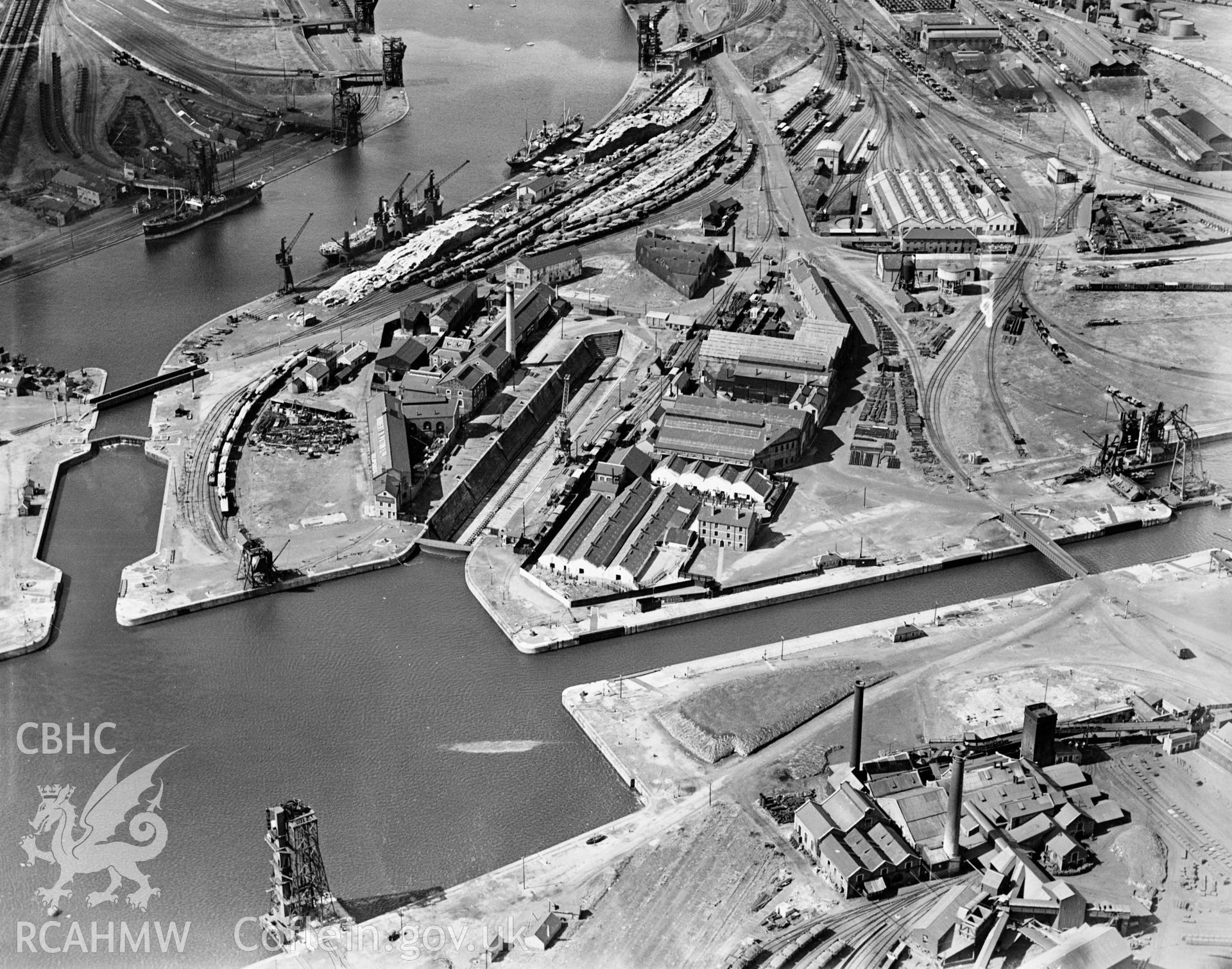 View of C.H. Bailey Ltd., dry dock owners & ship repairers and surrounding dockyard, Cardiff, oblique aerial view. 5?x4? black and white glass plate negative.