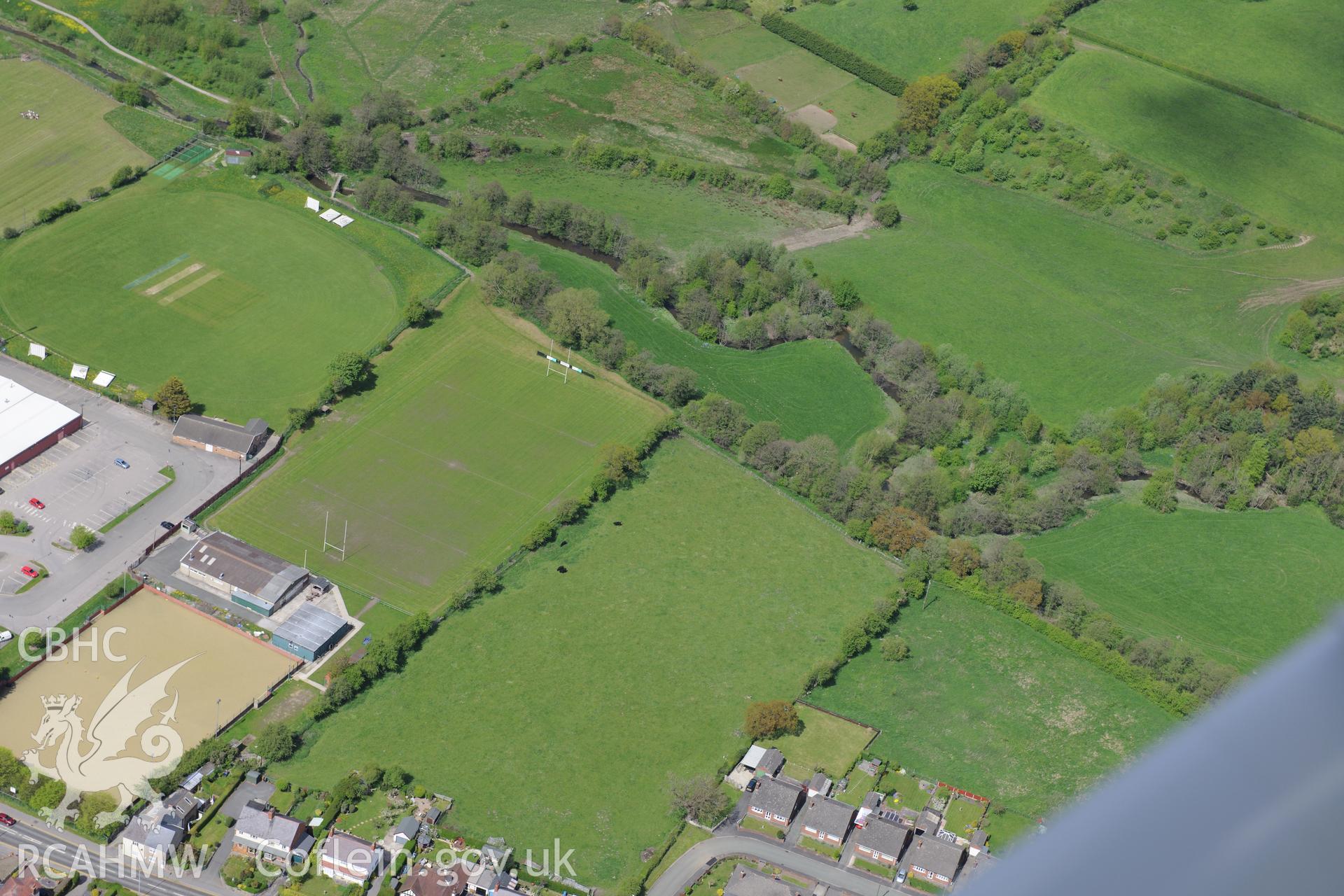 Bryn-yr-Ellyllon Tumulus (findspot of Mold gold cape), Mold. Oblique aerial photograph taken during the Royal Commission?s programme of archaeological aerial reconnaissance by Toby Driver on 22nd May 2013.