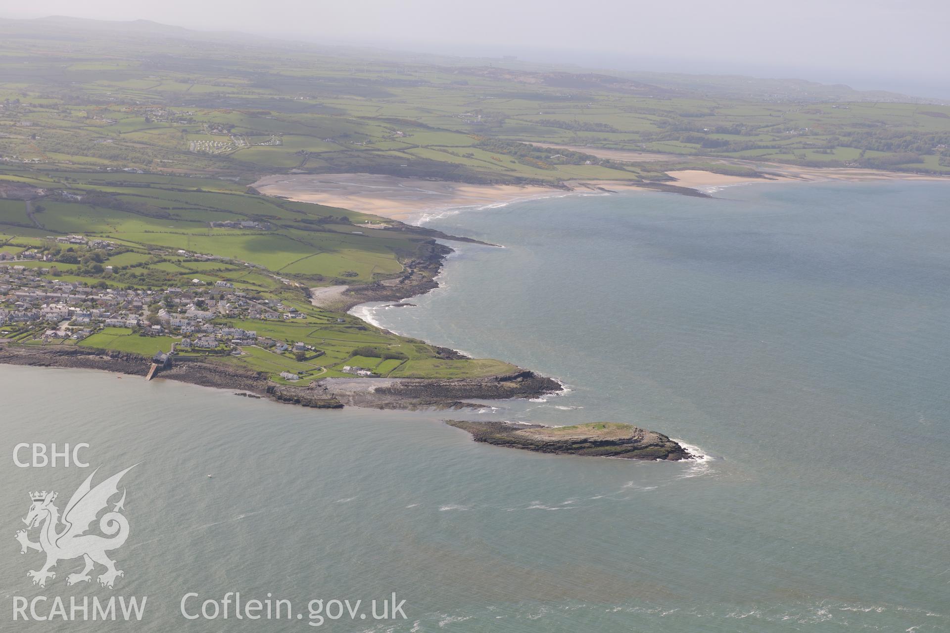 Moelfre, and the enclosure on Ynys Moelfre. Oblique aerial photograph taken during the Royal Commission?s programme of archaeological aerial reconnaissance by Toby Driver on 22nd May 2013.