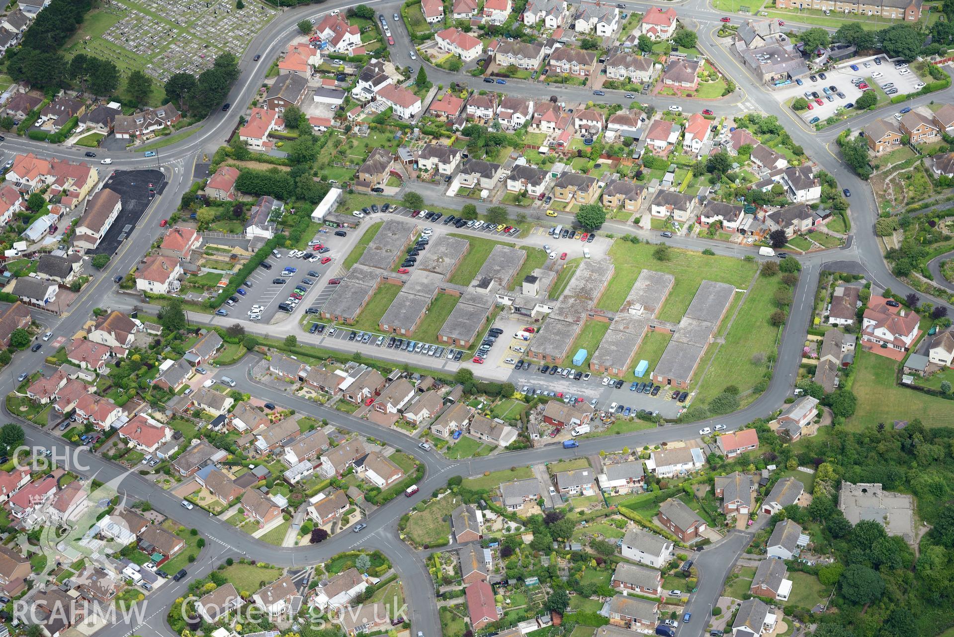 Rhos-on-Sea and the remains of Llys Euryn. Oblique aerial photograph taken during the Royal Commission's programme of archaeological aerial reconnaissance by Toby Driver on 30th July 2015.