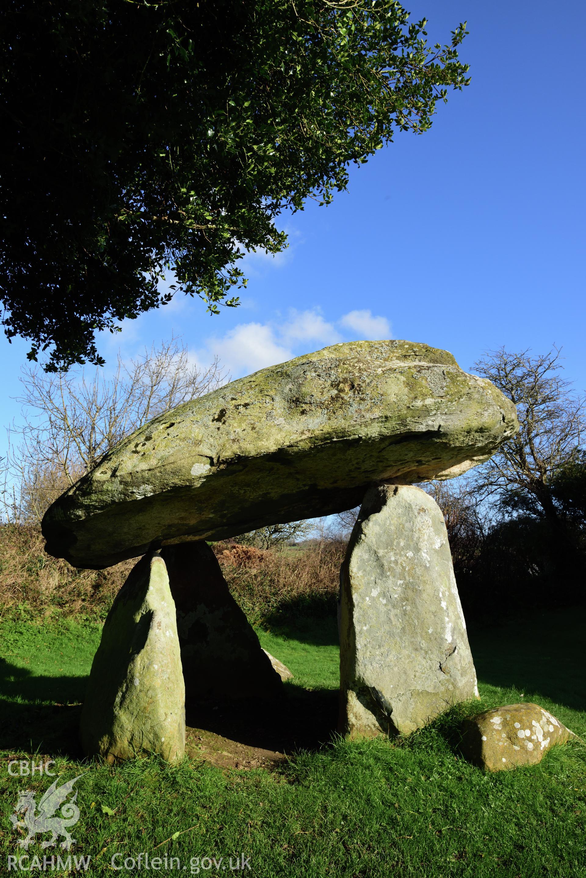 Royal Commission photo survey of Carreg Coetan chambered tomb in winter light, by Toby Driver