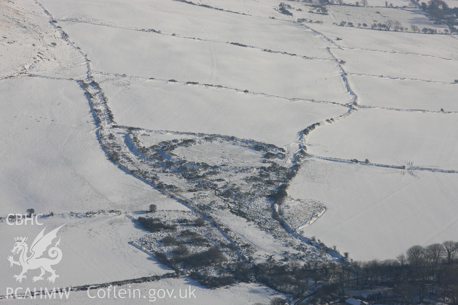 Cas-Fuwch defended enclosure, Castlebythe, south east of Fishguard. Oblique aerial photograph taken during the Royal Commission?s programme of archaeological aerial reconnaissance by Toby Driver on 24th January 2013.
