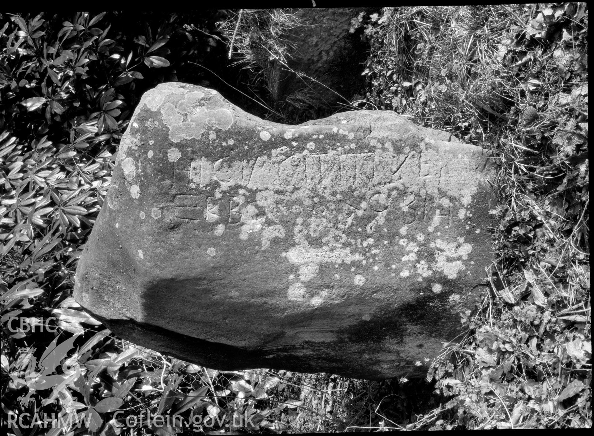 Digital copy of a nitrate negative showing inscribed stone at Downing Hall.