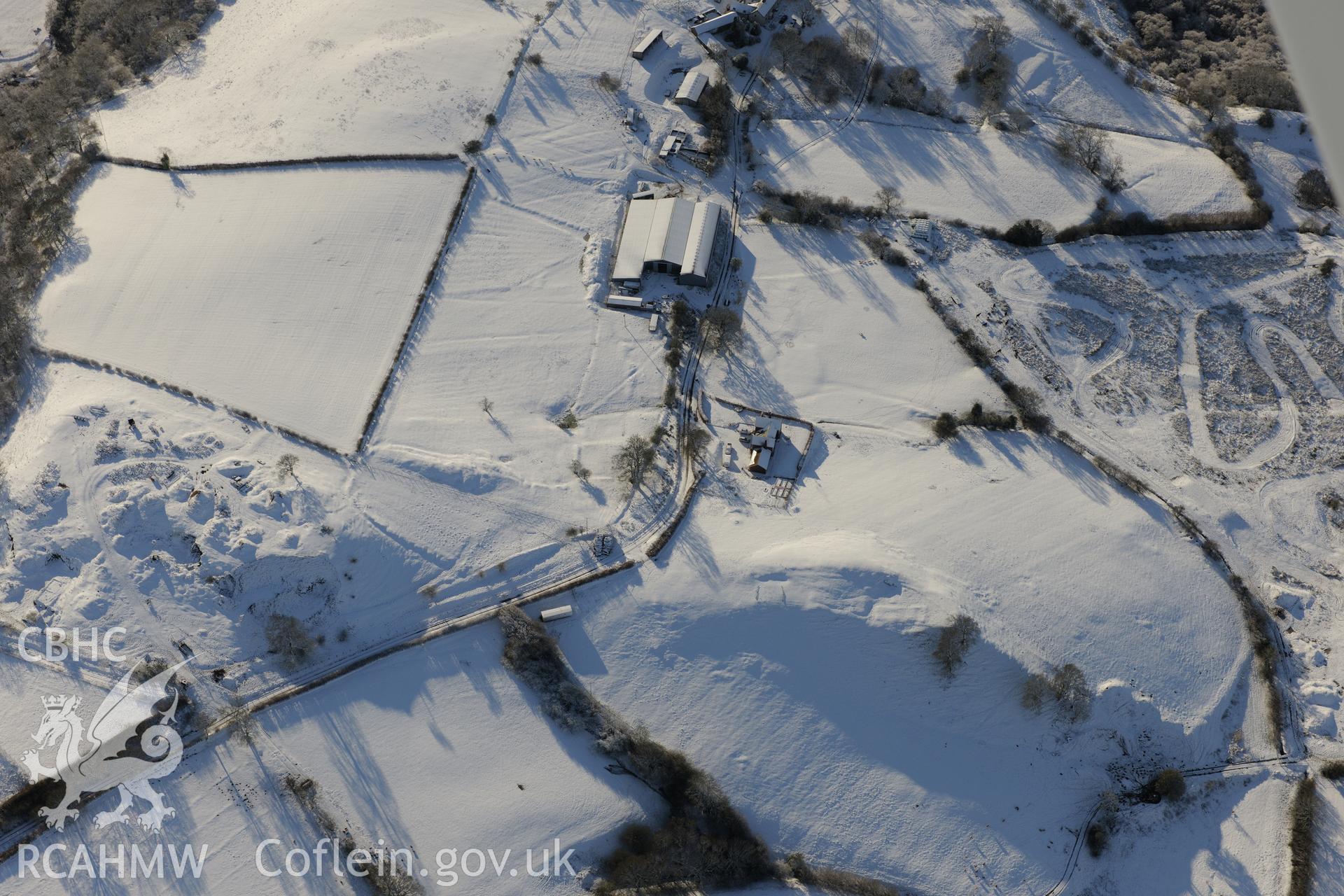 Earthworks of a longhouse and Cefnllys Castle deer park, Penybont, north east of Llandrindod Wells. Oblique aerial photograph taken during the Royal Commission?s programme of archaeological aerial reconnaissance by Toby Driver on 15th January 2013.