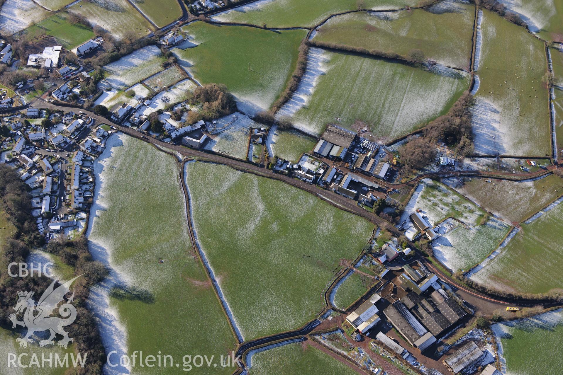 Pendre-Uchaf farm and the village of Llangorse. Oblique aerial photograph taken during the Royal Commission?s programme of archaeological aerial reconnaissance by Toby Driver on 15th January 2013.