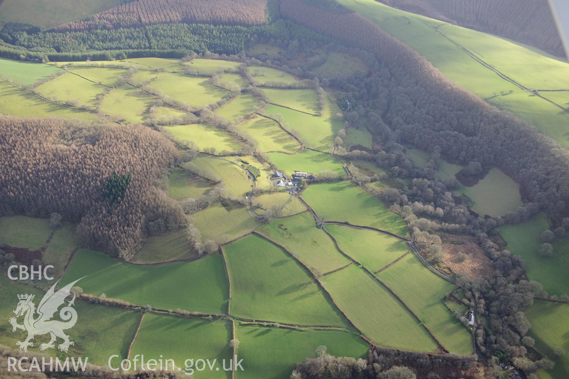 Esgair Dda Farm and part of the Cothi Roman Aqueduct. Oblique aerial photograph taken during the Royal Commission's programme of archaeological aerial reconnaissance by Toby Driver on 6th January 2015.